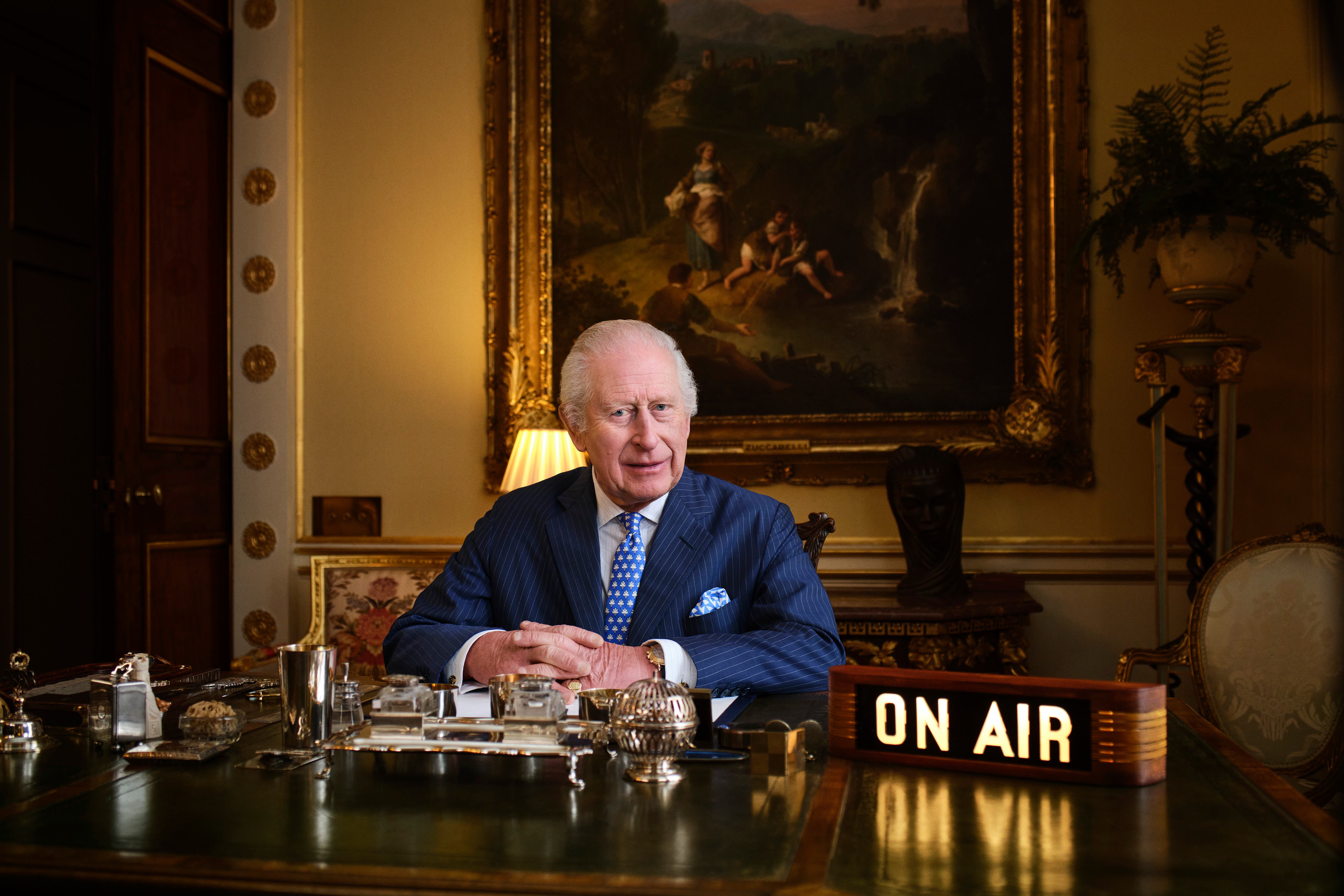 The King sat at his desk in Buckingham Palace recording The King’s Music Room for Apple Music (The King’s Music Room/Courtesy of Apple Music/PA)