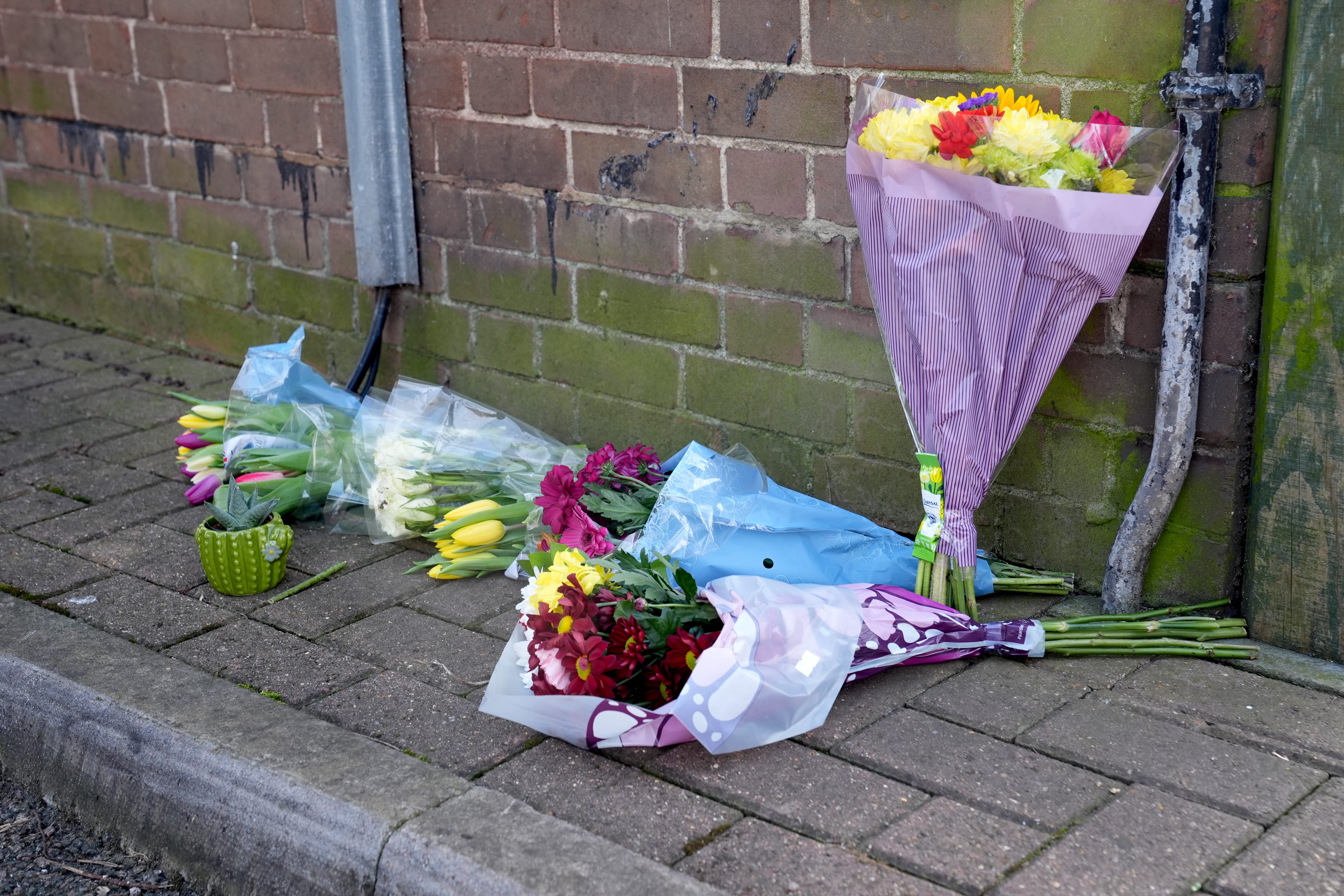 Floral tributes near the scene in Paradise Road, south London (Lucy North/PA)