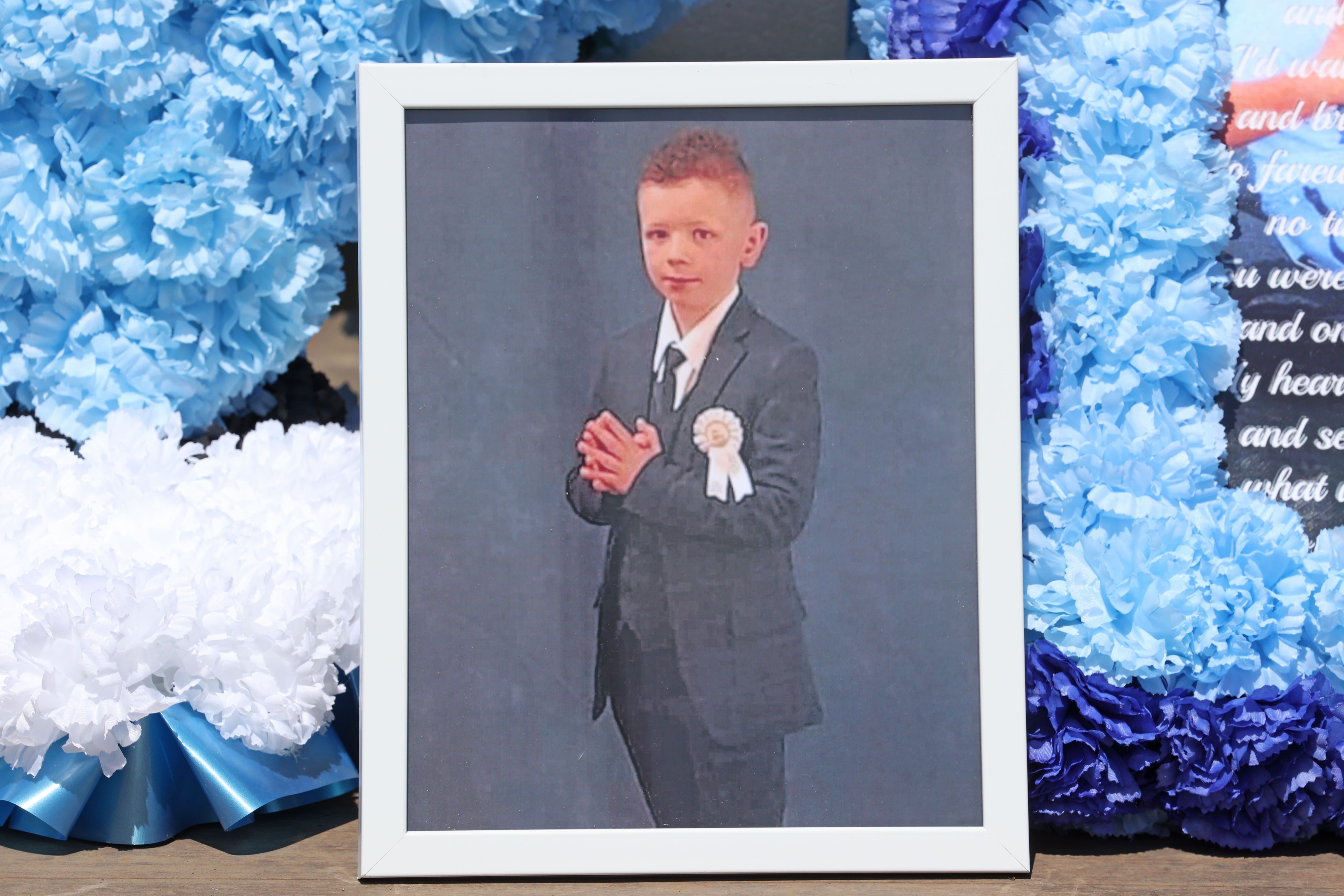A photo of Charlie Joyce, nine, outside All Saints Church in Ballymena, ahead of his funeral (Liam McBurney/PA)