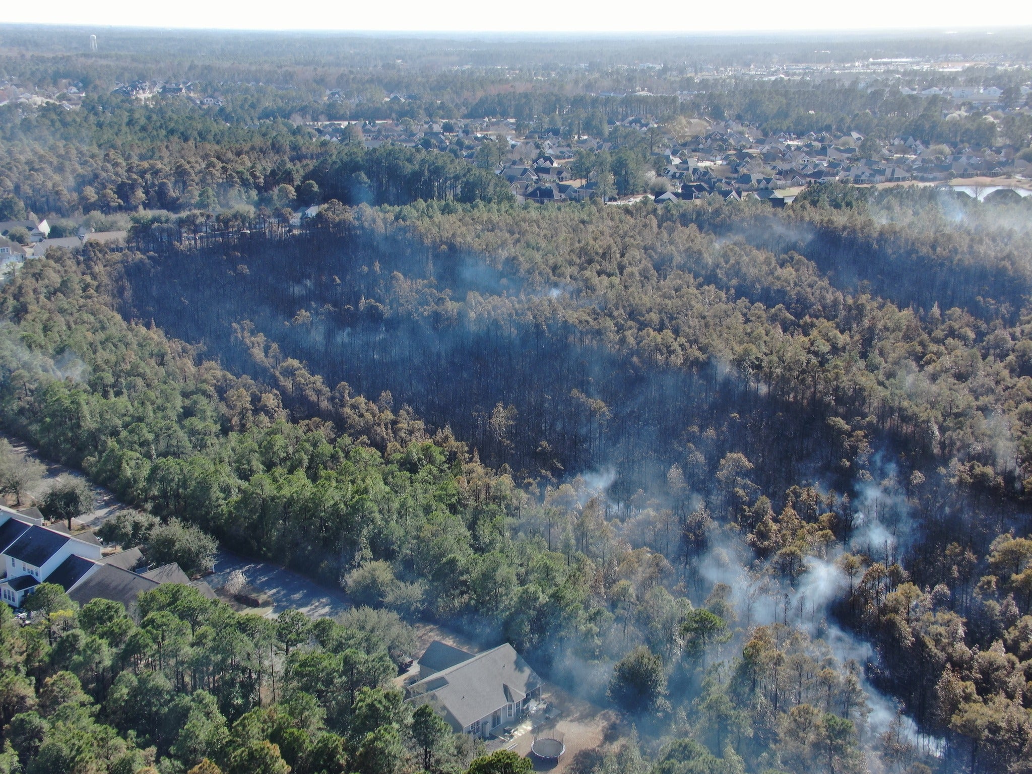 The Carolina Forest fire, also known as the Covington Drive fire, is now 55 percent contained. The National Guard is assisting firefighters in their effort to suppress the blaze