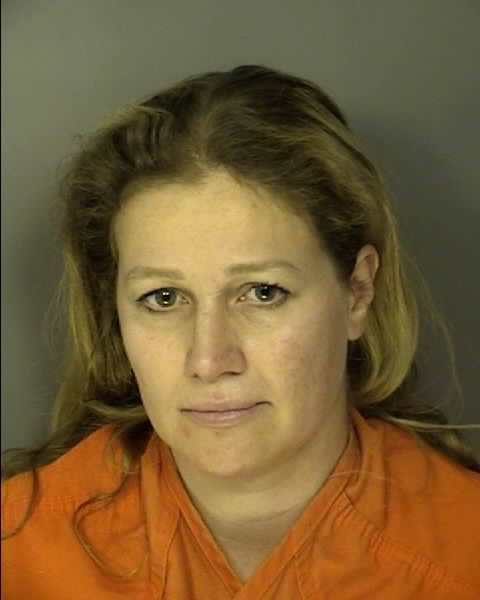 South Carolina Forestry Commission law enforcement officials arrested Alexandra Bialousow, 40, of Myrtle Beach on Thursday on two charges related to the escape of a residential yard debris burn that is alleged to have ignited the Carolina Forest Fire near Myrtle Beach. The blaze spread over 2,059 acres