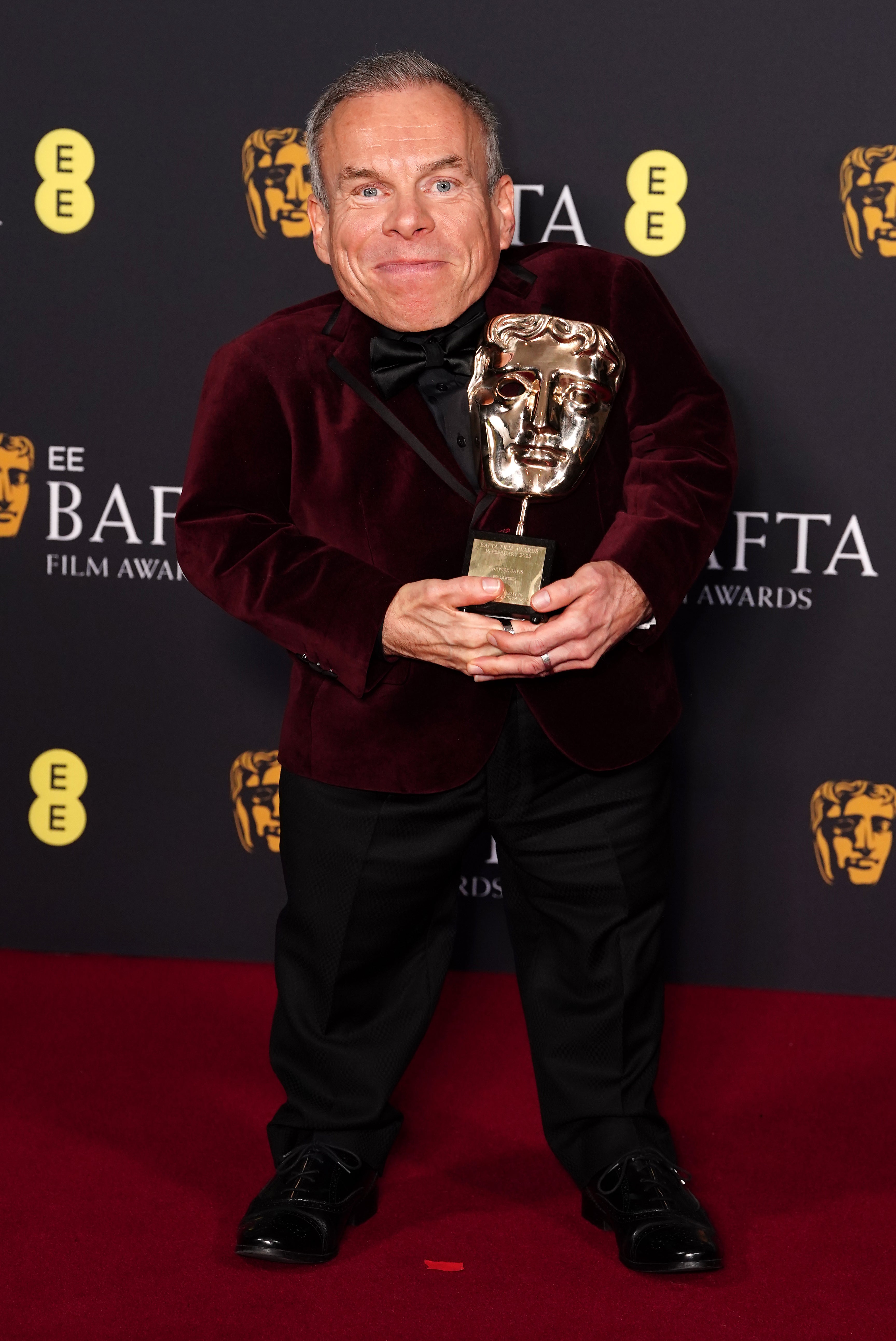 Warwick Davis after winning the Bafta Fellowship award