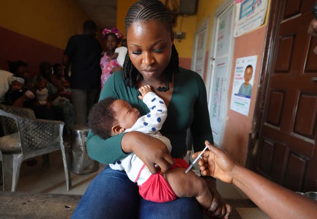 <p>A health worker administers the malaria vaccine in Yenagoa, Nigeria</p>