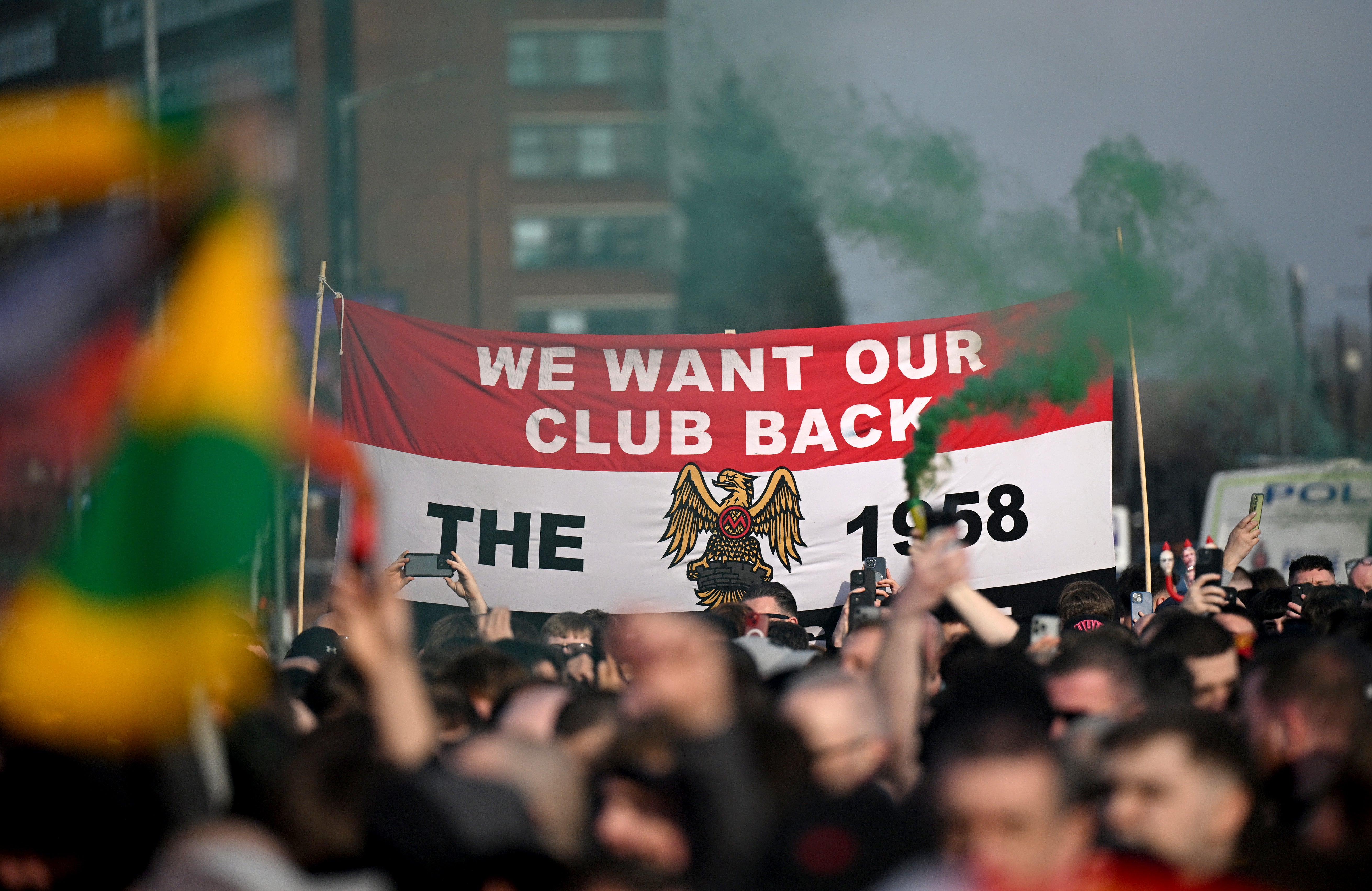 Manchester United fans protest the Glazer family's ownership outside the stadium