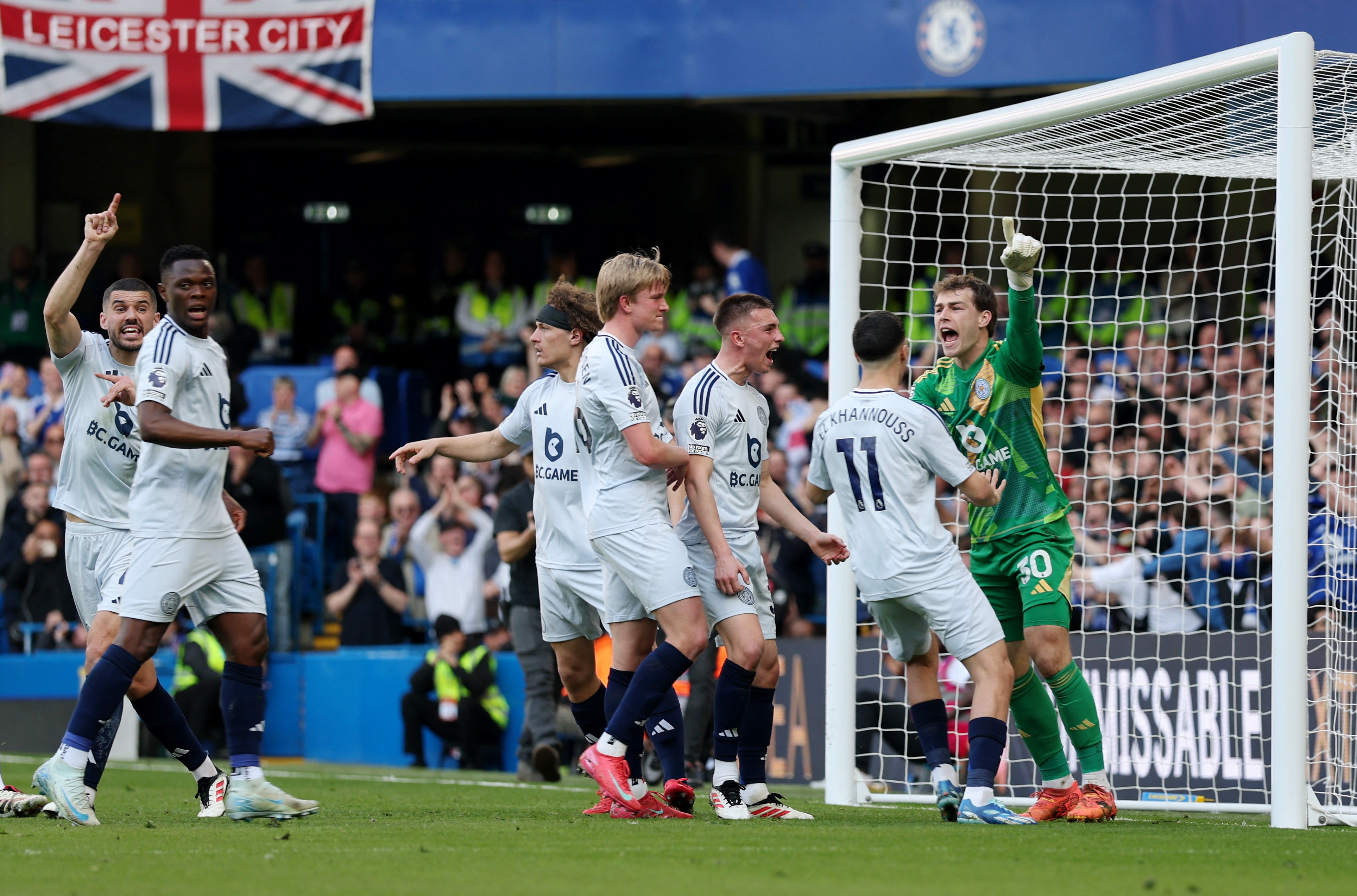 The goalkeeper is congratulated by his teammates
