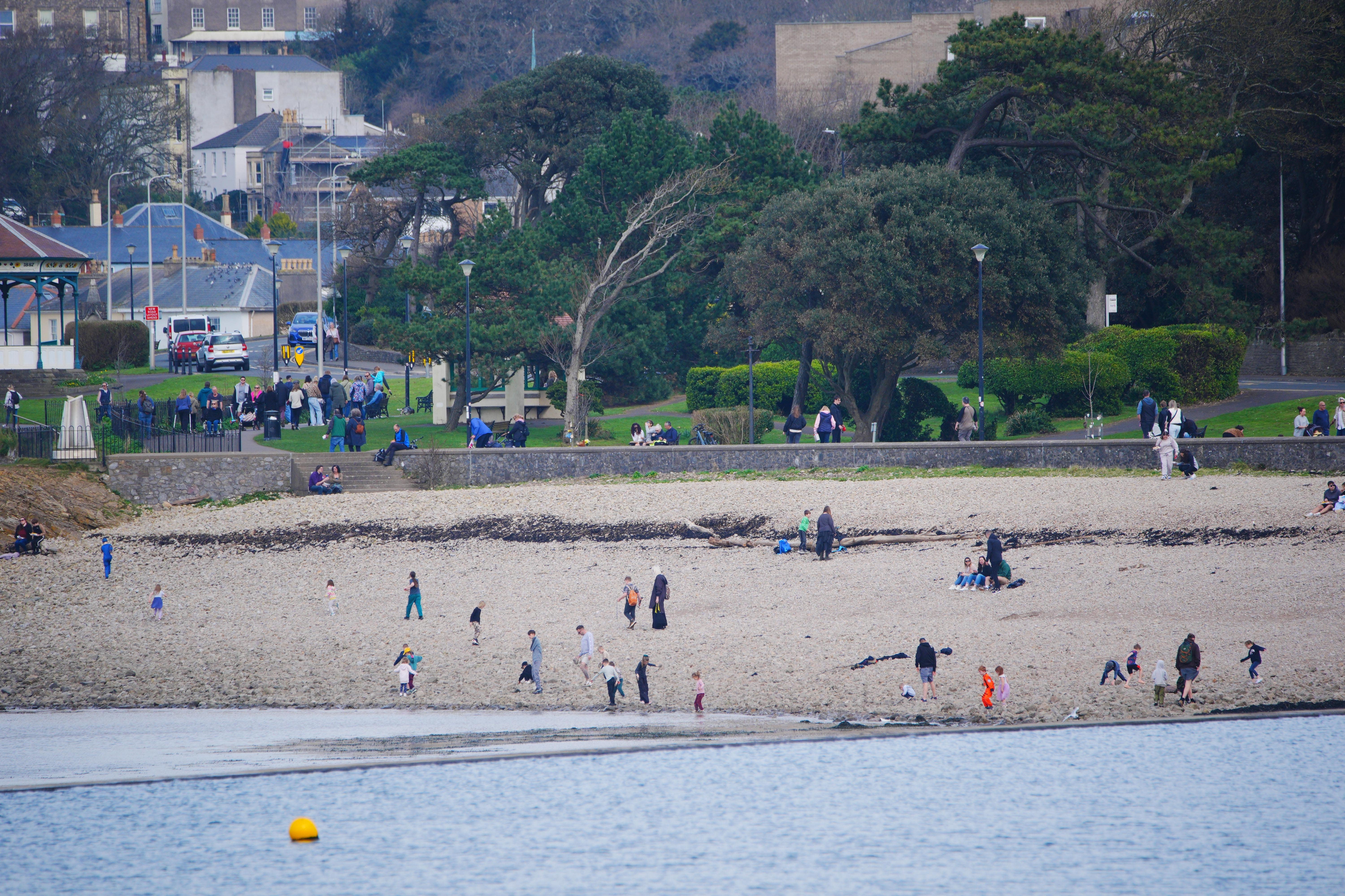 People enjoy the warm weather at Clevedon Marine Lake (Ben Birchall/PA)