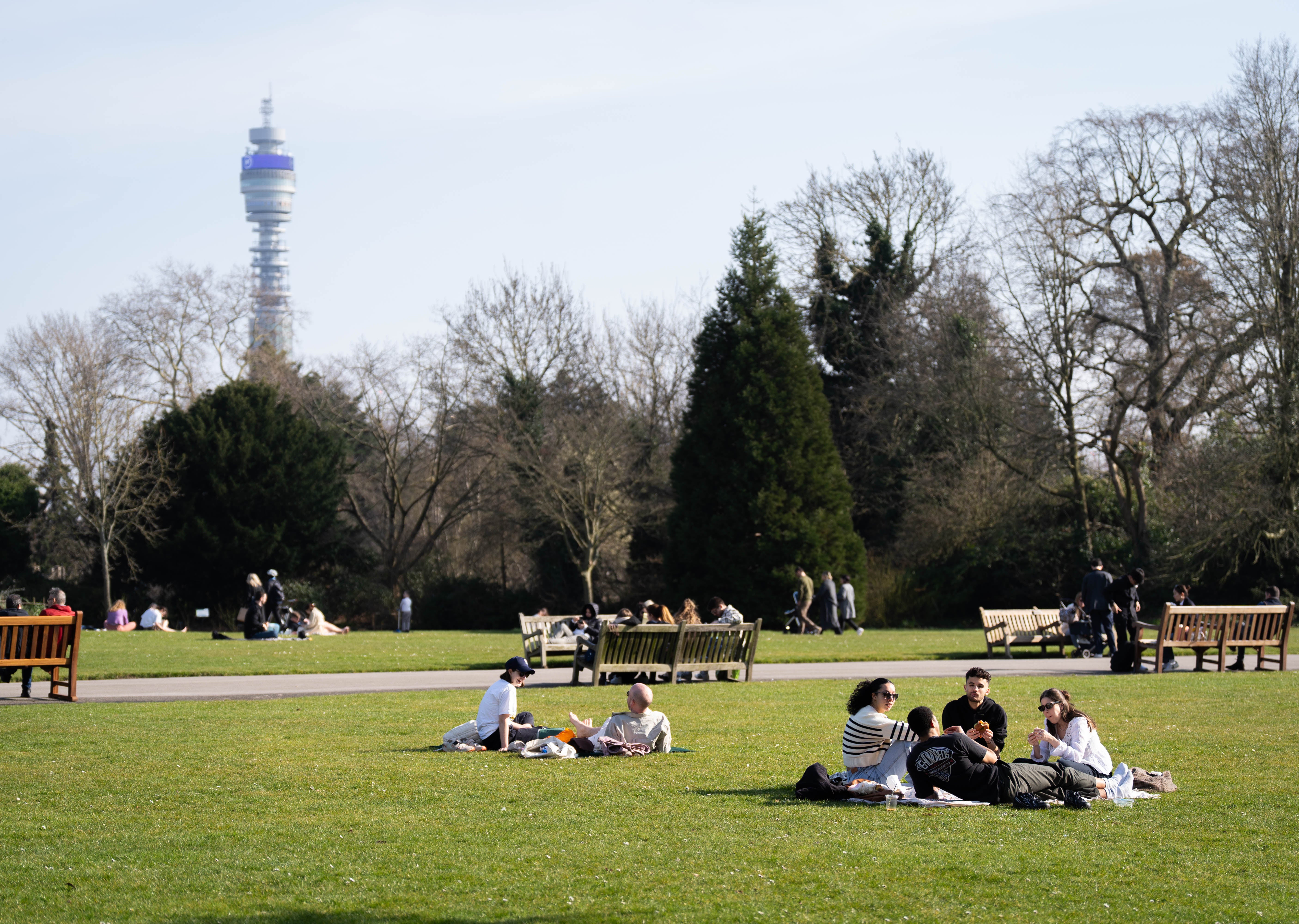 People enjoy the balmy weather in Regent’s Park, central London
