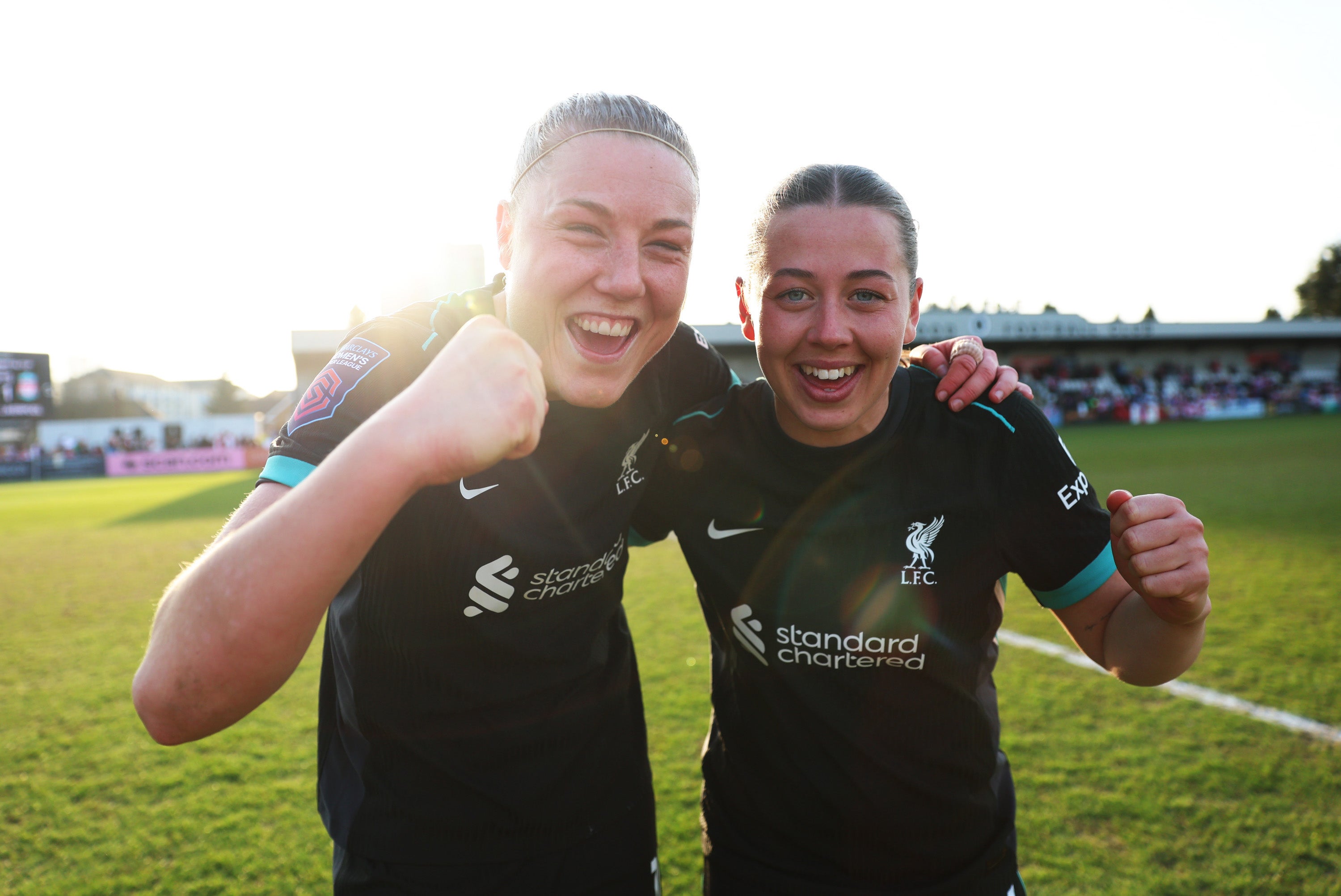 Liverpool's Sophie Roman Haug celebrates with Cornelia Kapocs