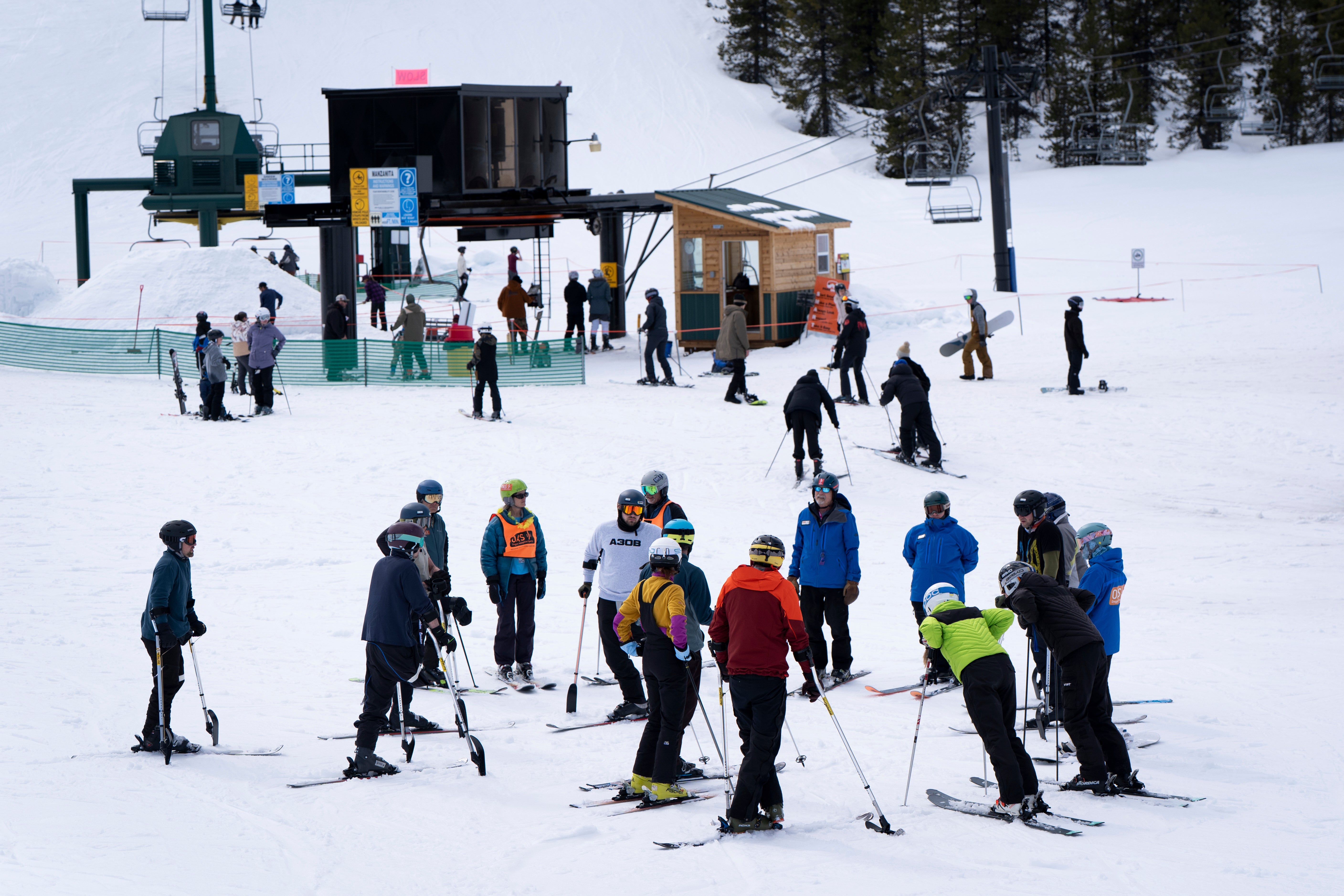 A group of Ukrainian veterans skiing at the Hoodoo Ski Area in Oregon. A family whose 4-year-old was seriously injured by a skier coming off a jump is suing the ski resort for $4.6 million