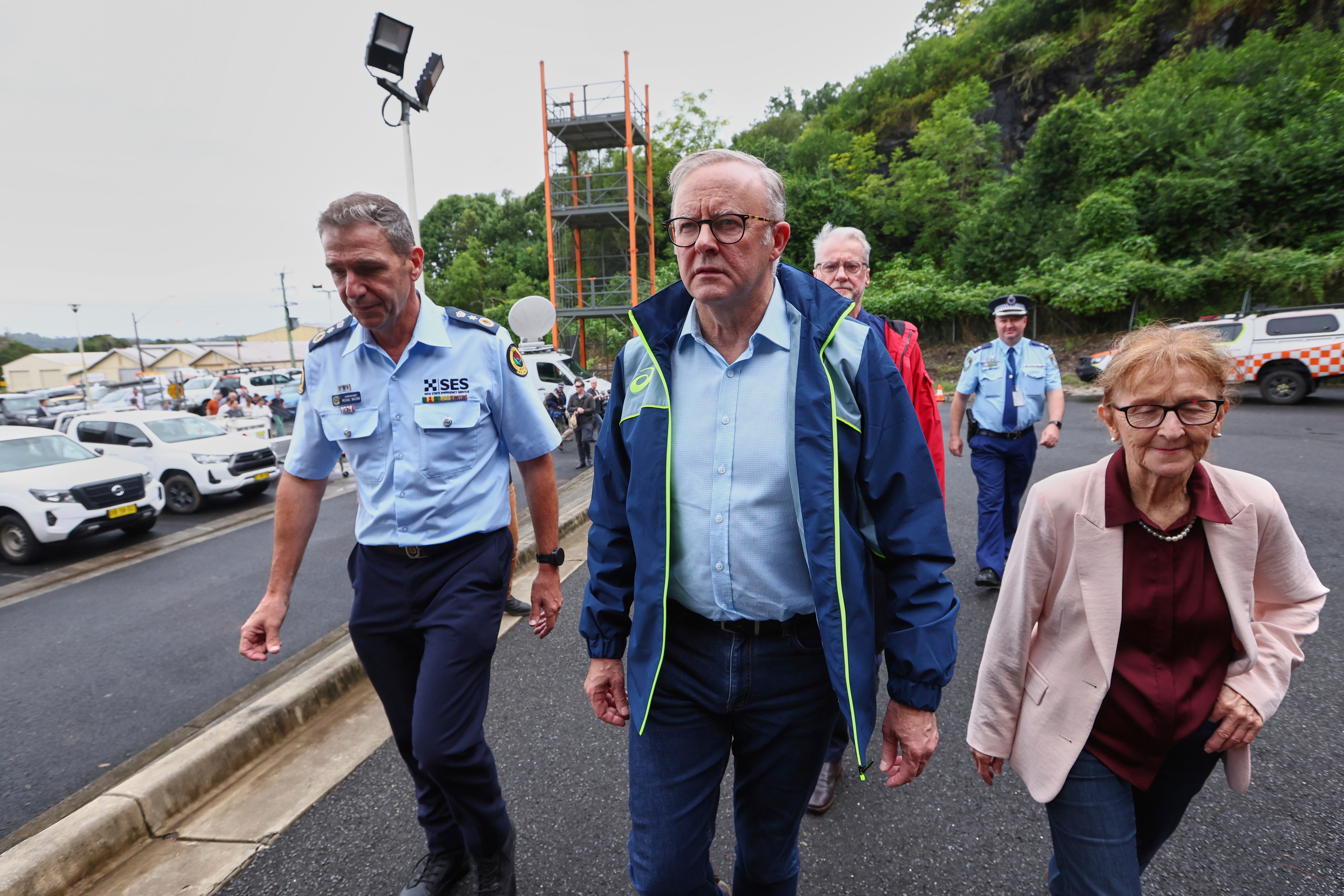 Australian Prime Minister Anthony Albanese, centre, arrives at a State Emergency Service centre in Lismore, Australia, Monday, 10 March 2025