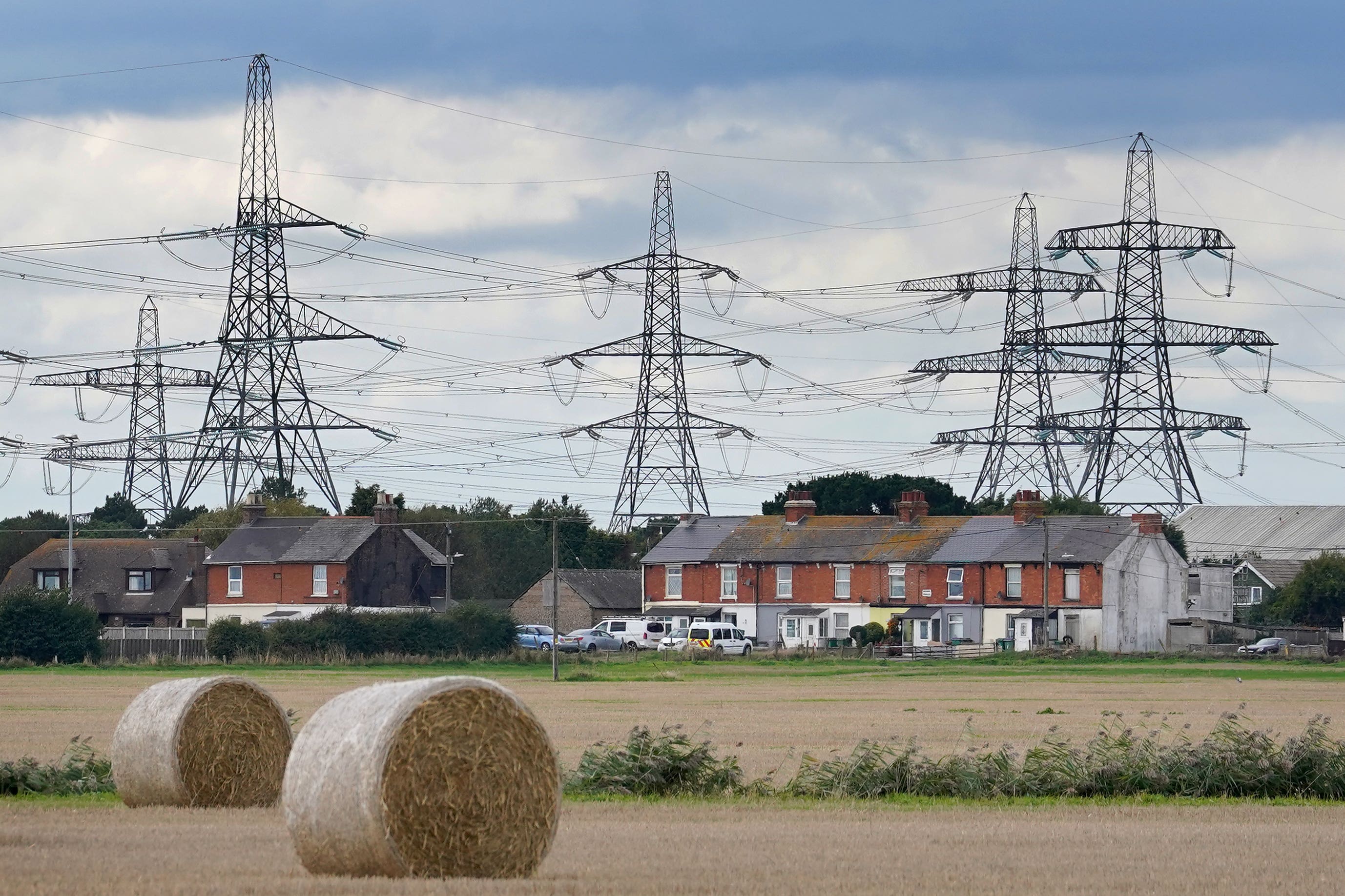 People who live near new pylons will get hundreds of pounds off their annual energy bills under plans to boost support for building infrastructure (Gareth Fuller/PA)