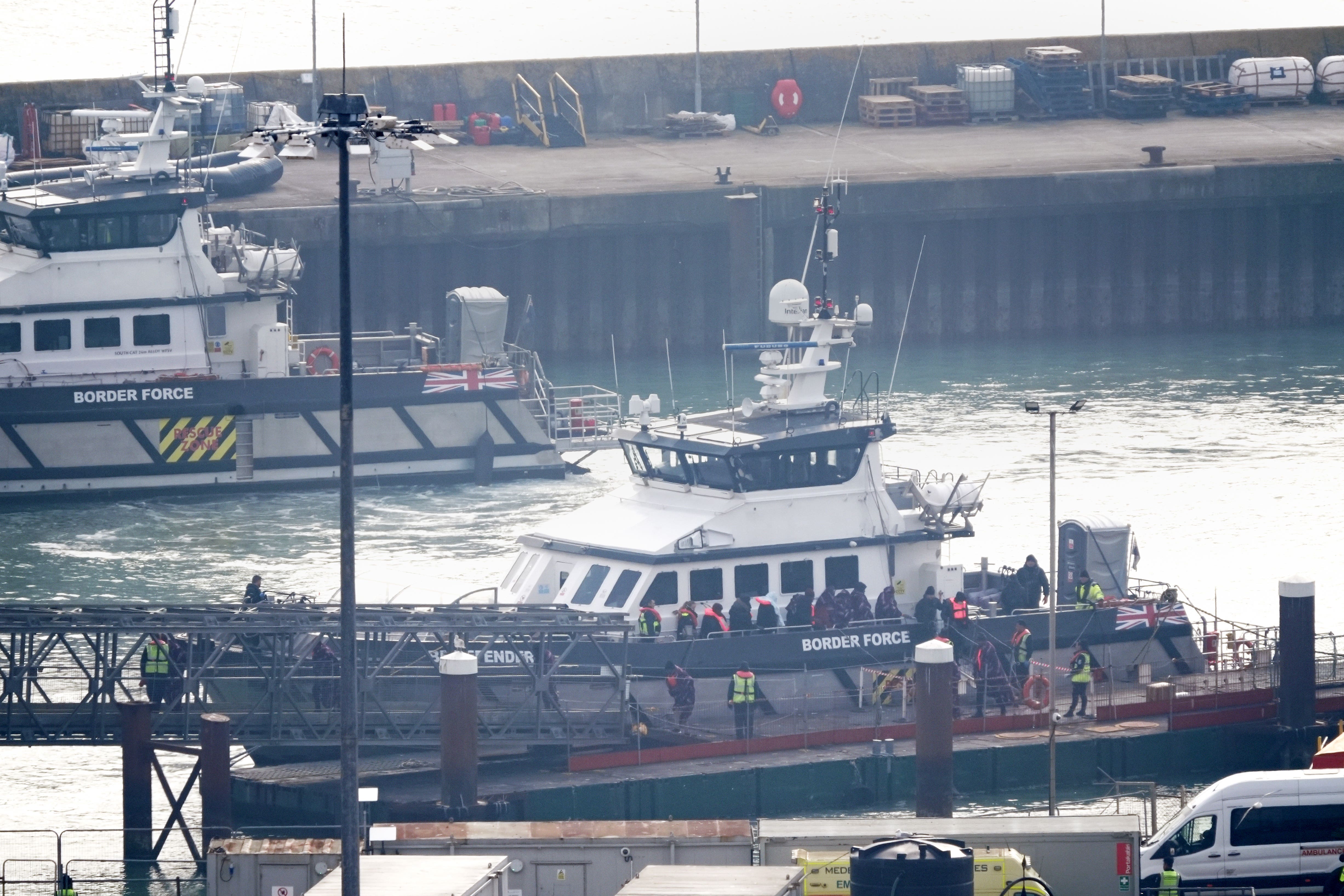 A group of people wearing life jackets were seen coming ashore in Dover, Kent, after disembarking from a Border Force boat on Monday (Gareth Fuller/PA)