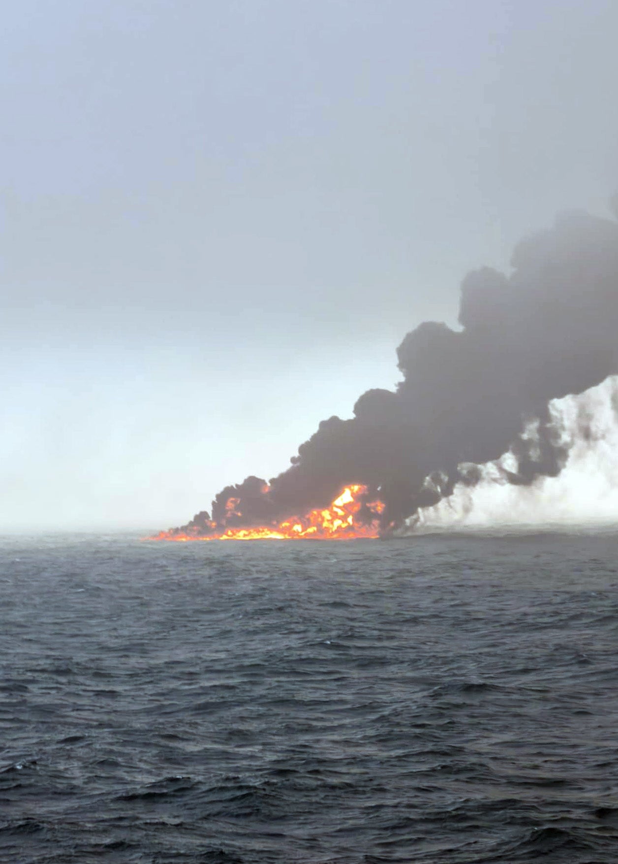 Black smoke billowing into the air after the crash off the coast of East Yorkshire