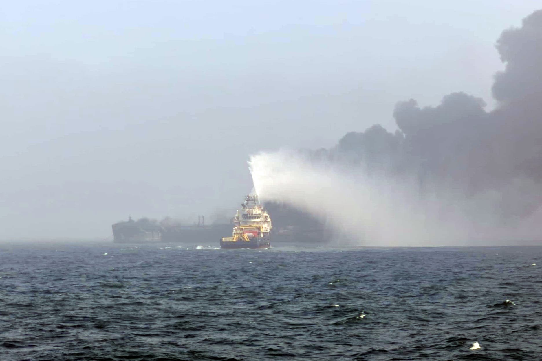 Smoke billowing into the air after a crash between an oil tanker and a cargo ship off the coast of East Yorkshire