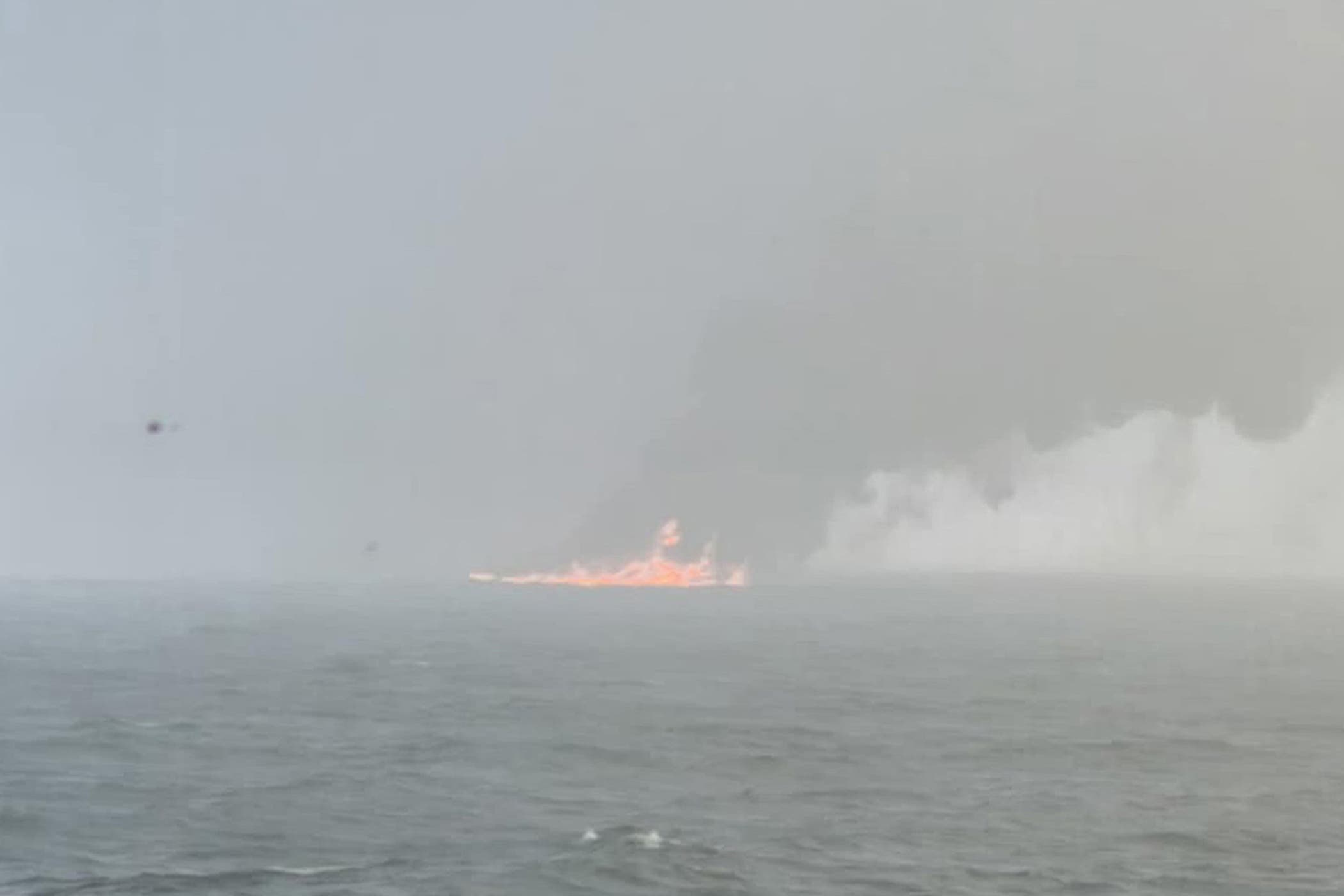 Smoke billowing into the air after a crash between an oil tanker and a cargo ship off the coast of East Yorkshire (Bartek Smialek)