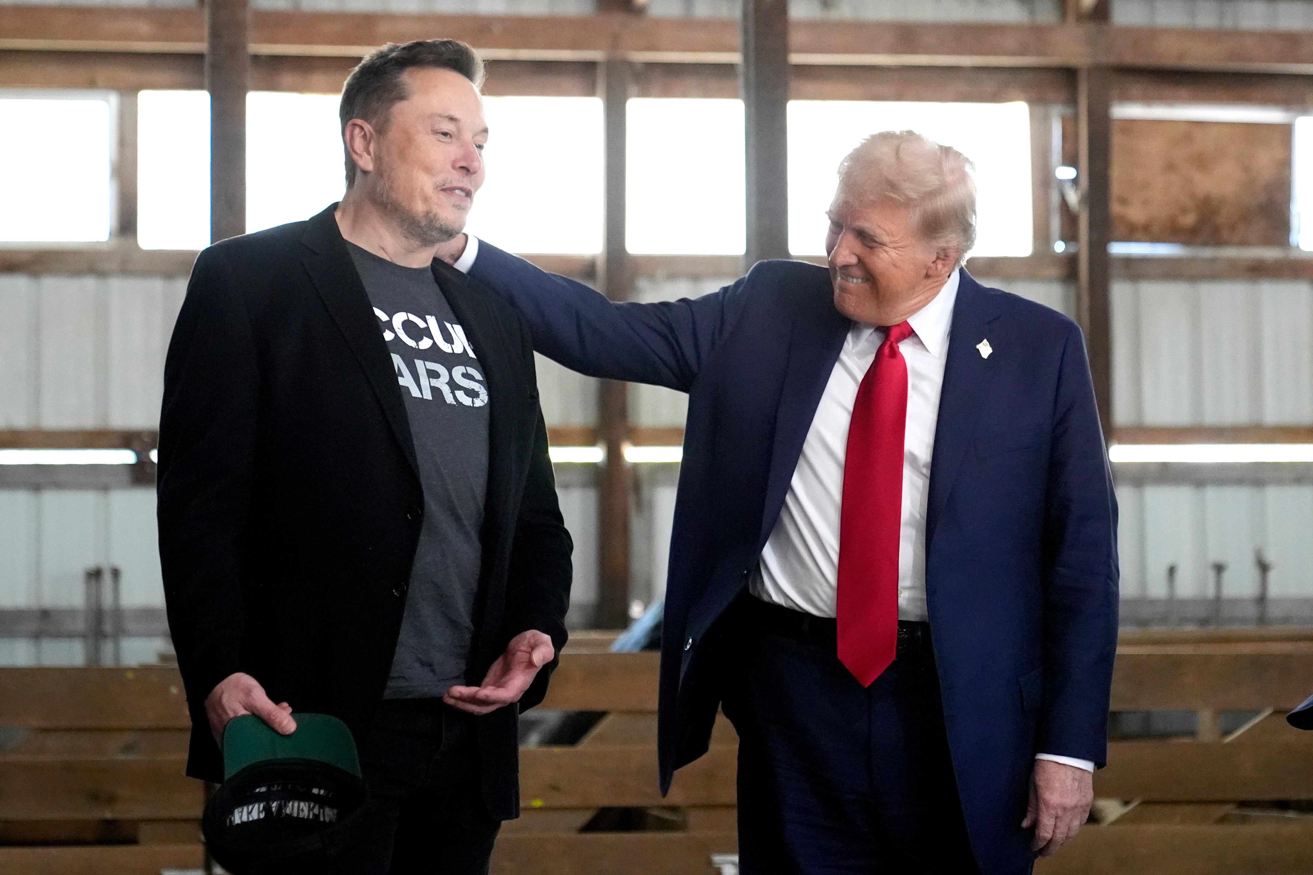 Musk (L) and Trump - pictured in Butler, Pennslyvania, on October 5 - had been subject to a tirade of criticism from Ken Casey while on stage over the past few weeks