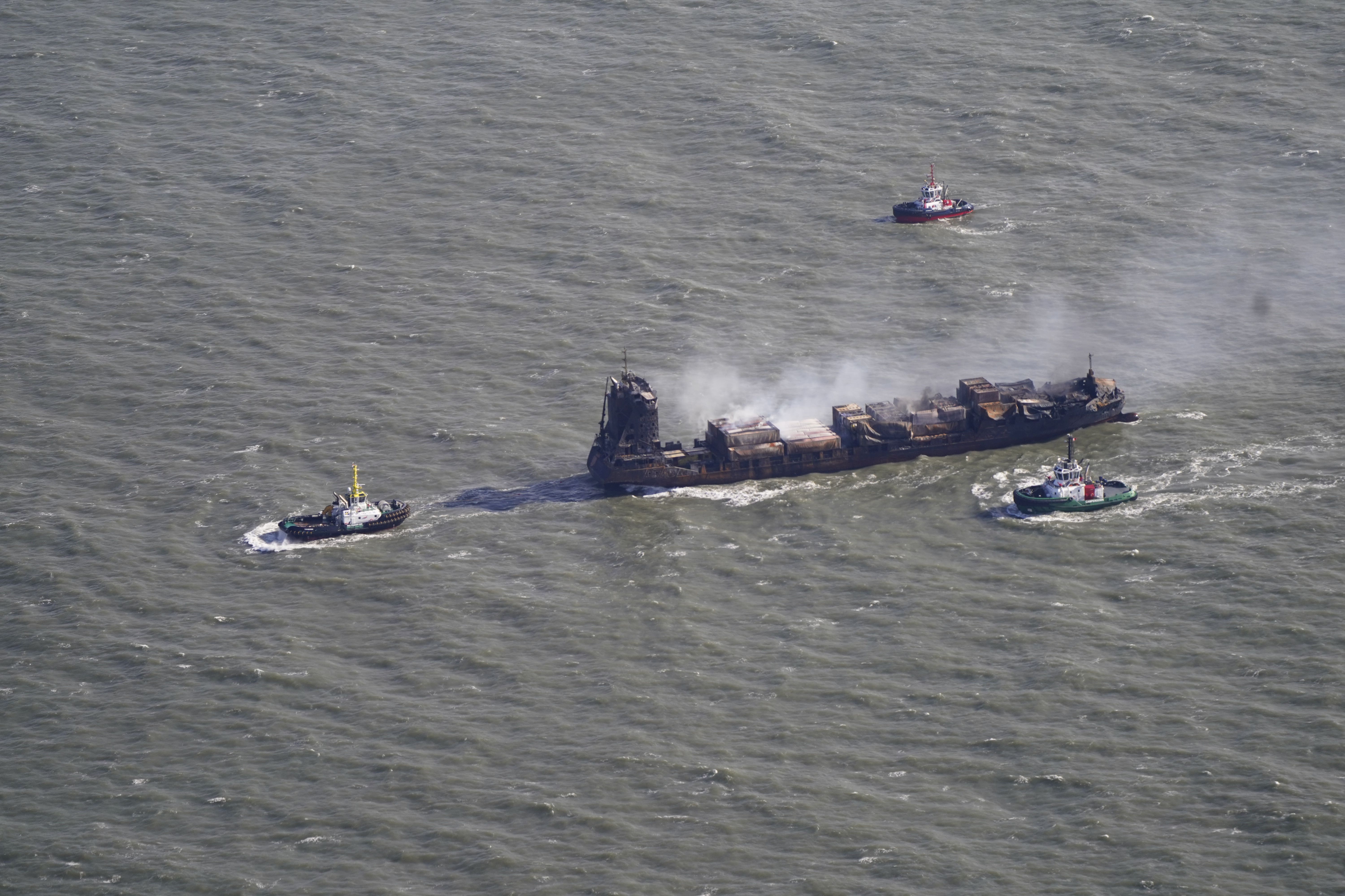 Tug boats shadow the Solong container ship as it drifts in the Humber Estuary, off the coast of East Yorkshire following a collision with the MV Stena Immaculate oil tanker, operating as part of the US government’s Tanker Security Programme, on Monday. Picture date: Tuesday March 11, 2025.