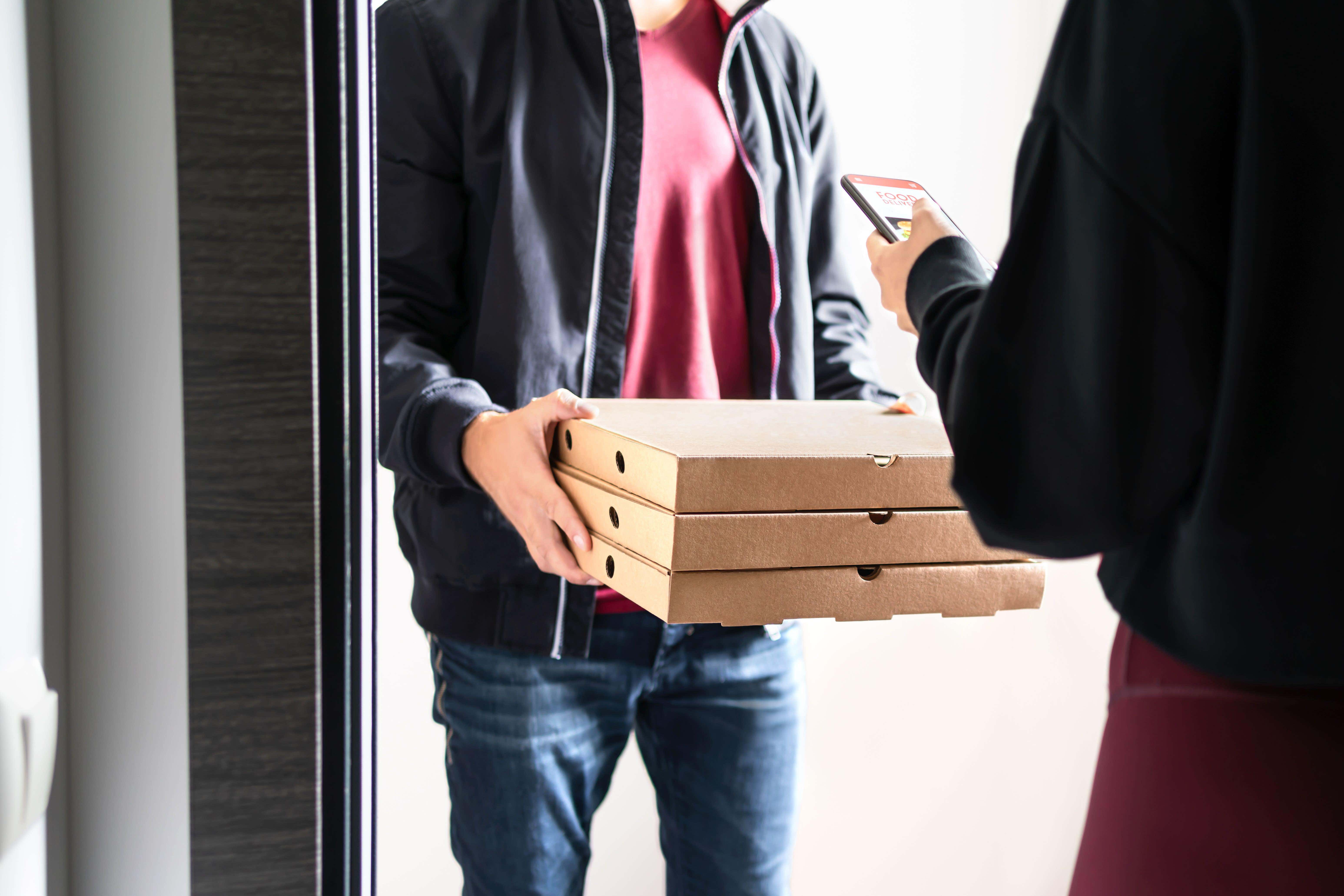 Food delivery companies should disclose the identities of riders and drivers amid fears of visa abuse (Alamy/PA)