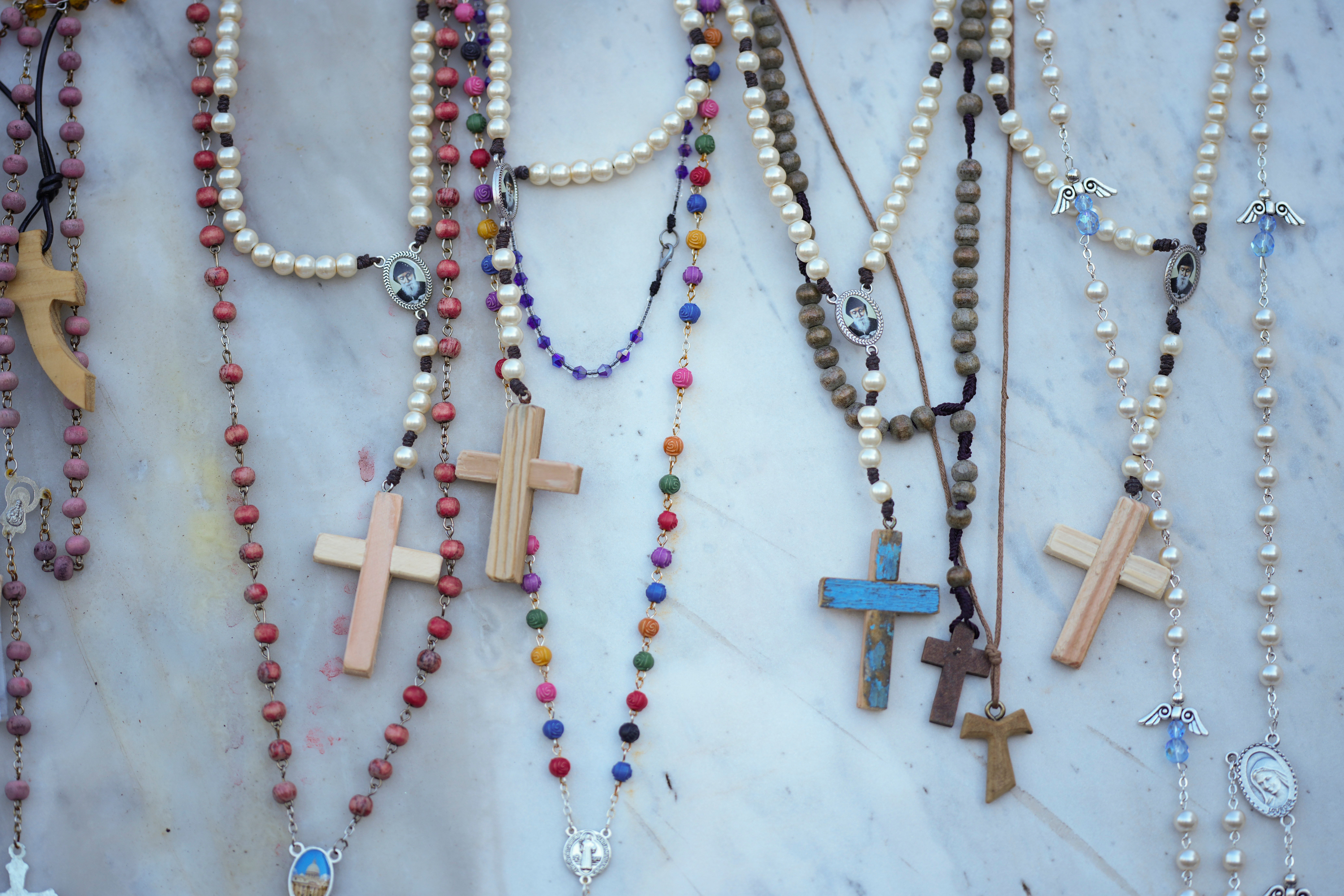 Rosaries for Pope Francis are seen in front of the Gemelli hospital