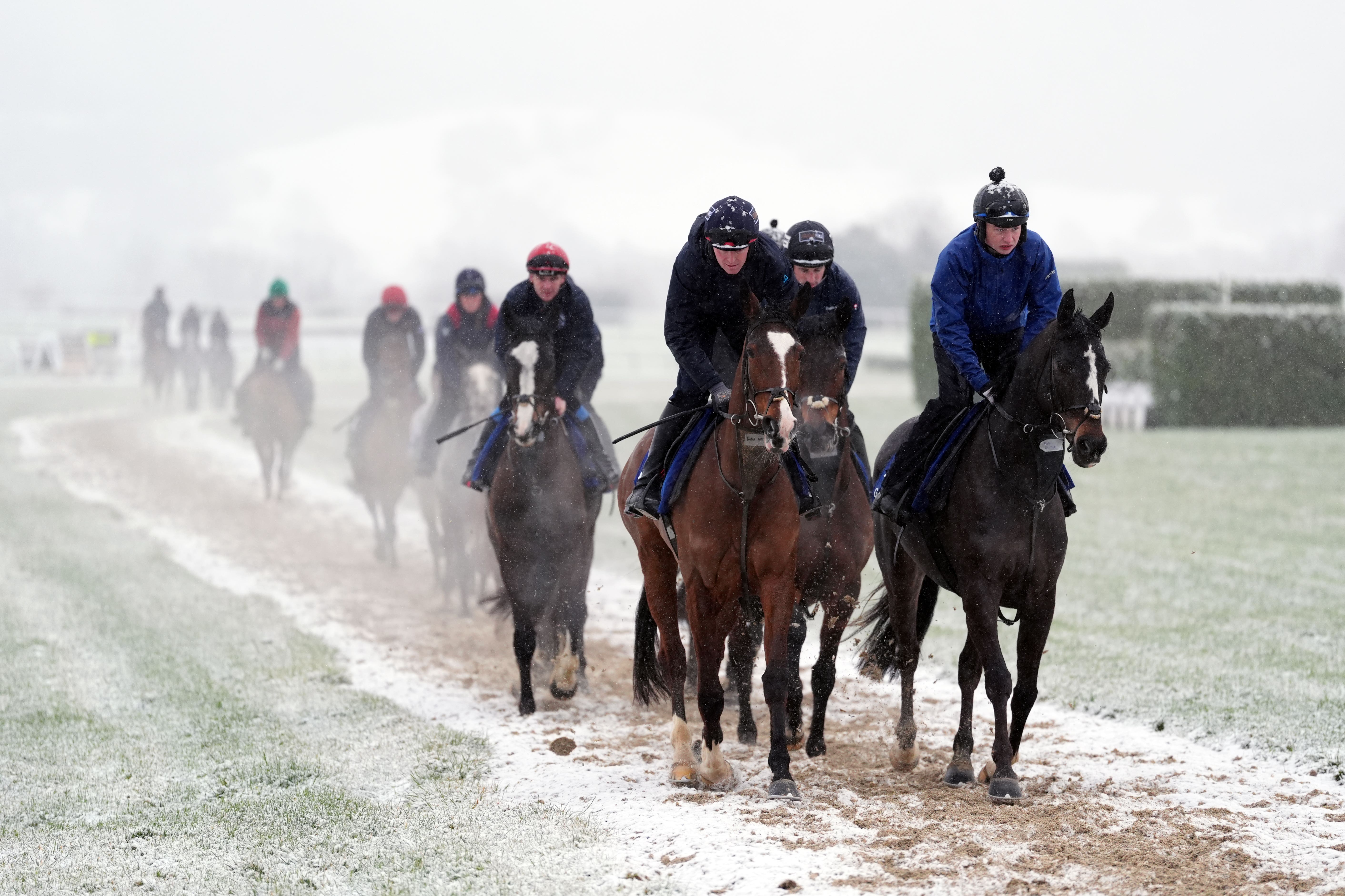 Horses on the snow-covered gallops on day two of the 2025 Cheltenham Festival at Cheltenham Racecourse (Adam Davy/PA)