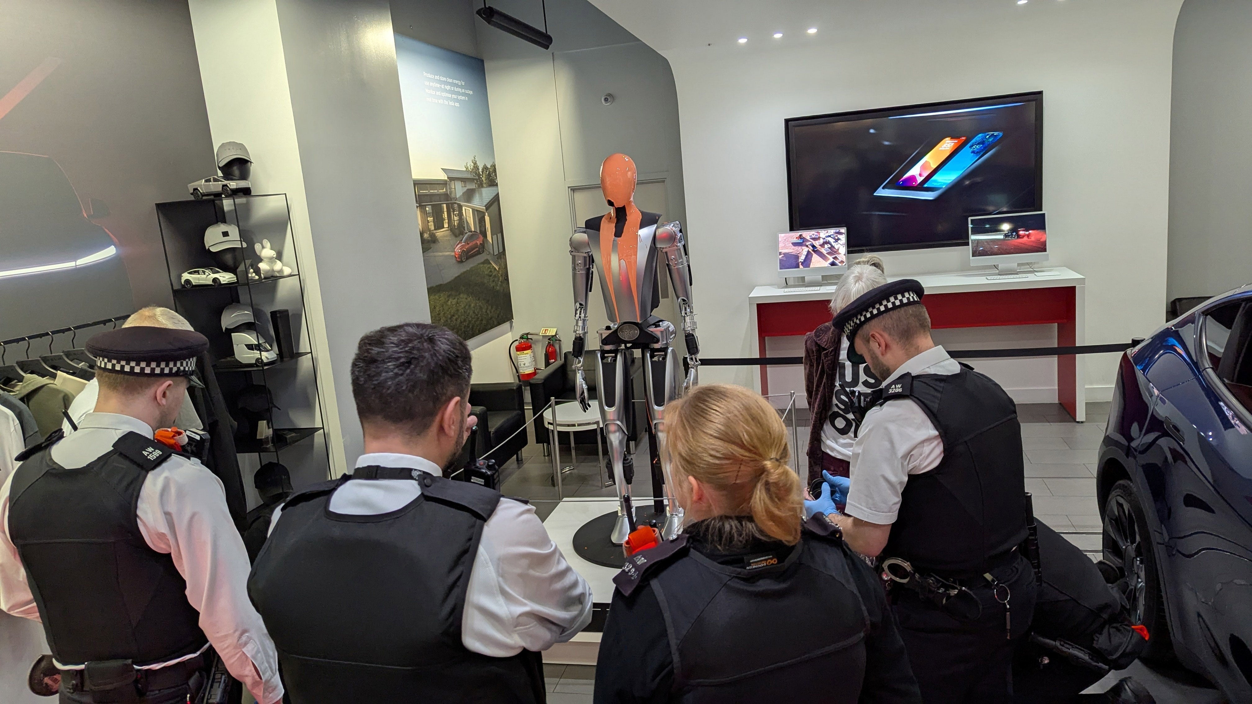 Campaigners poured paint over the robot and unfurled a Just Stop Oil banner (Just Stop Oil/PA Wire)