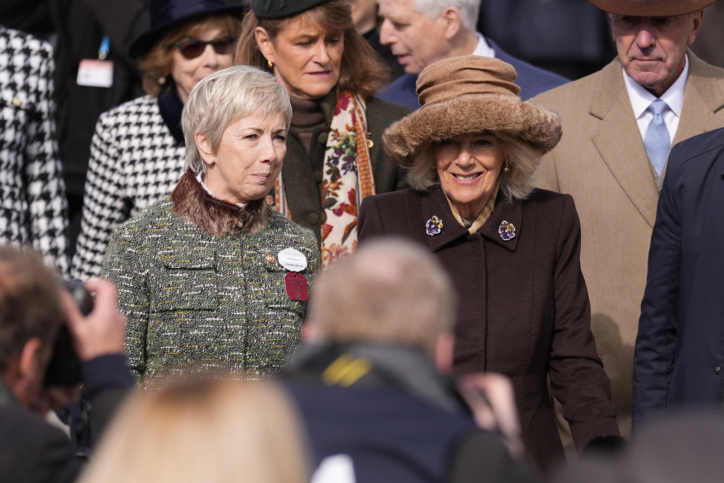 Queen Camilla (right) was among the crowds at Style Wednesday, formerly Ladies Day, at Cheltenham Festival on Wednesday