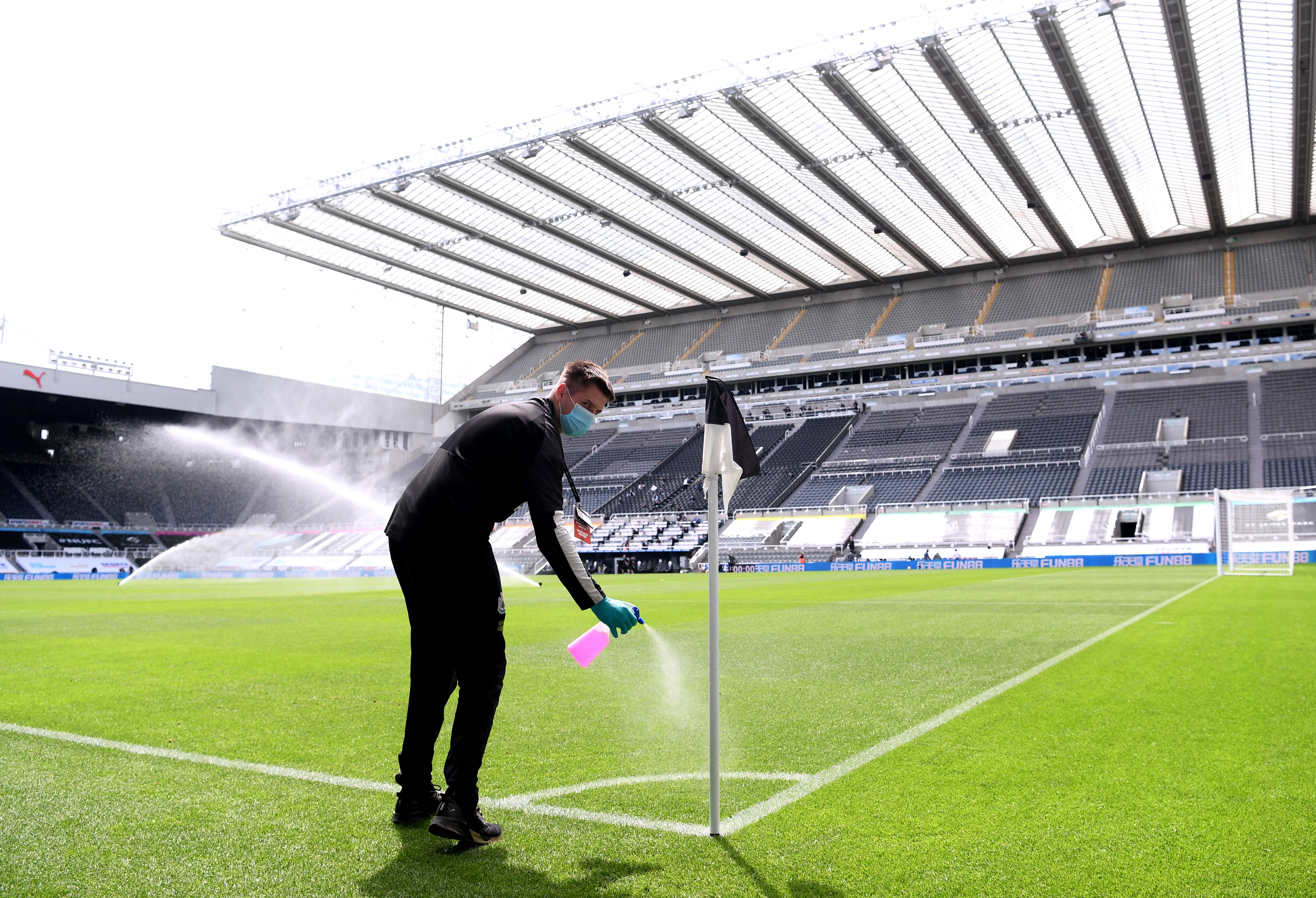 Ground staff disinfect St James' Park during the 2020-21 season