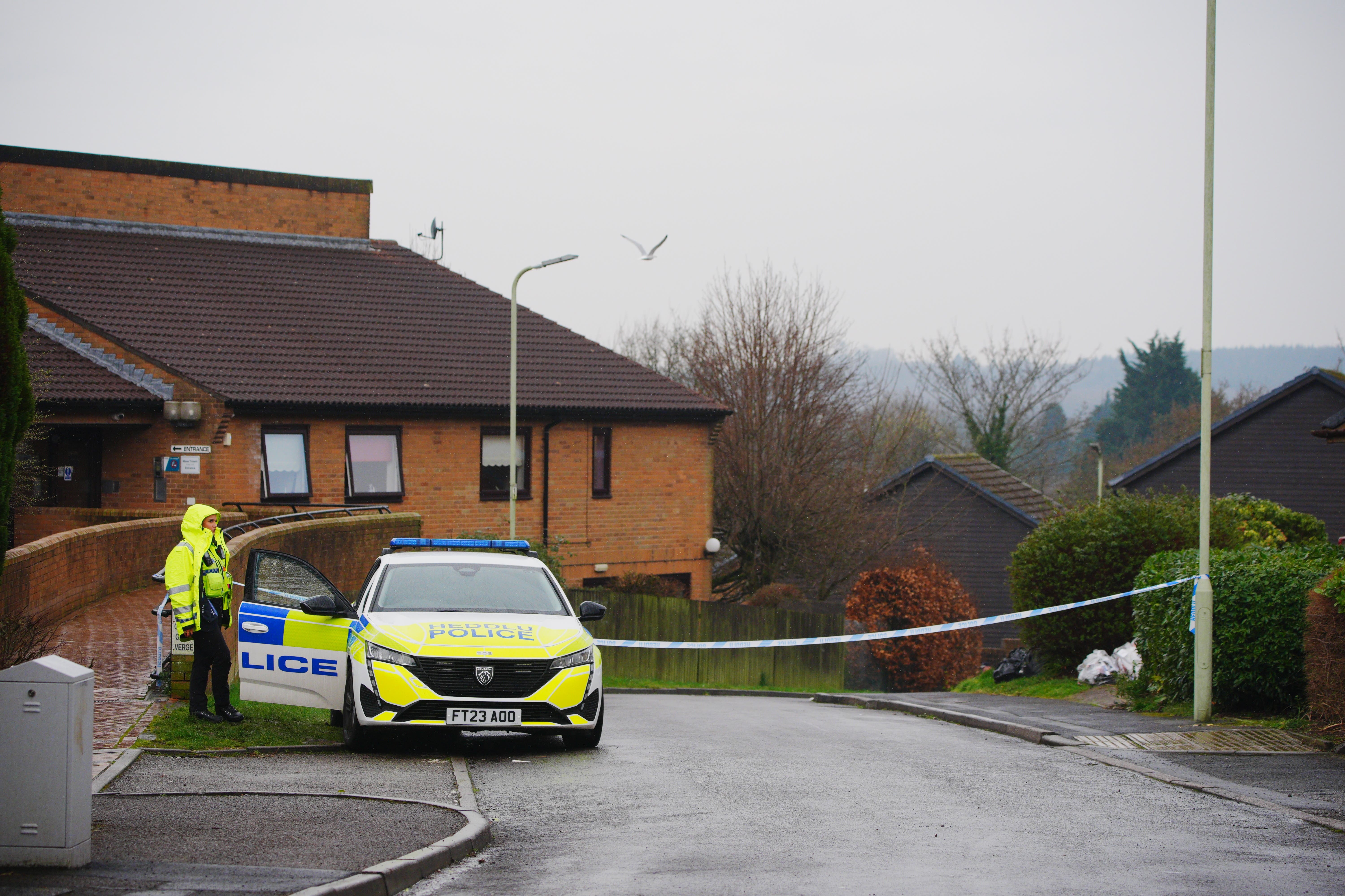 Police at the scene in Talbot Green (Ben Birchall/PA)