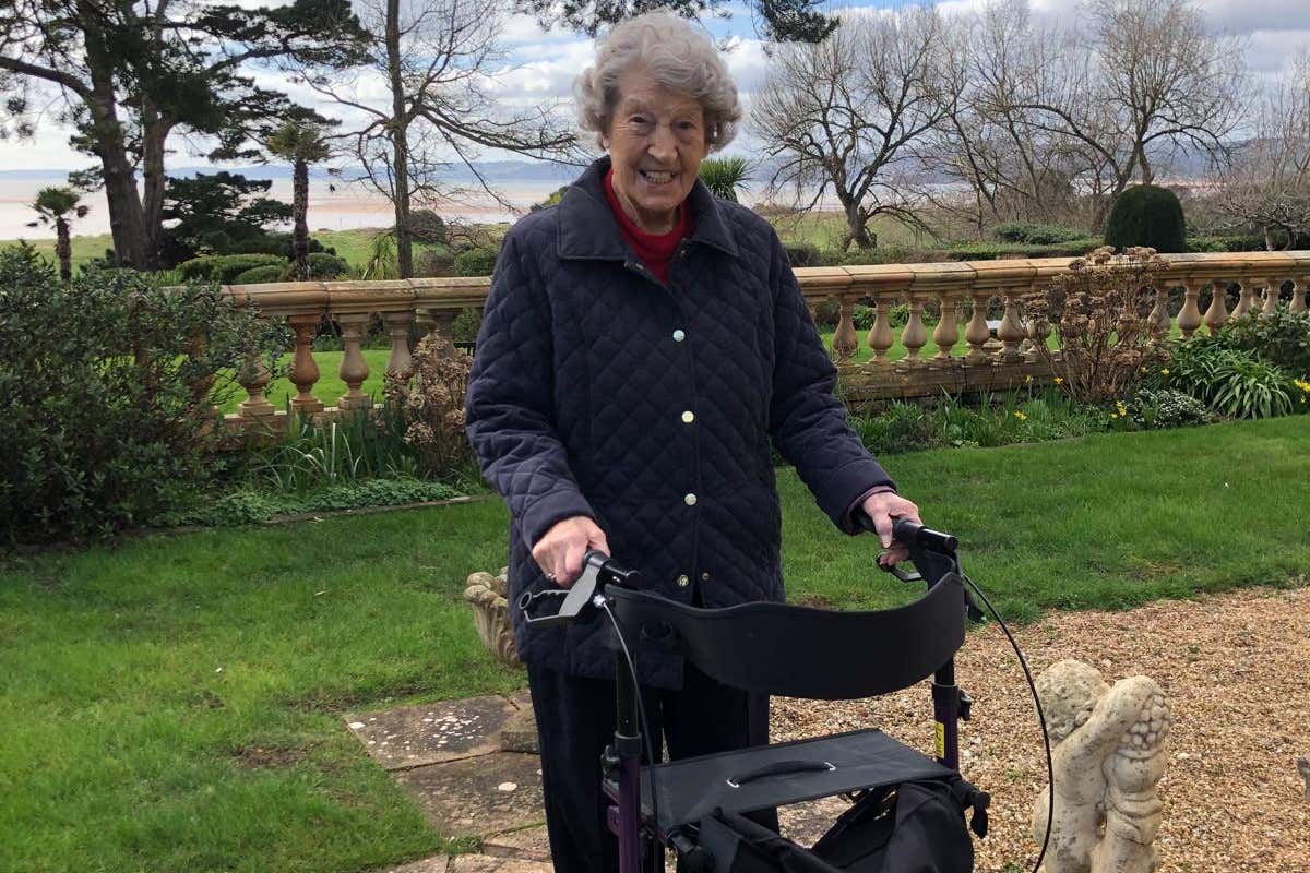 Joy back home in Exmouth, exercising with her walking frame (family handout/PA)