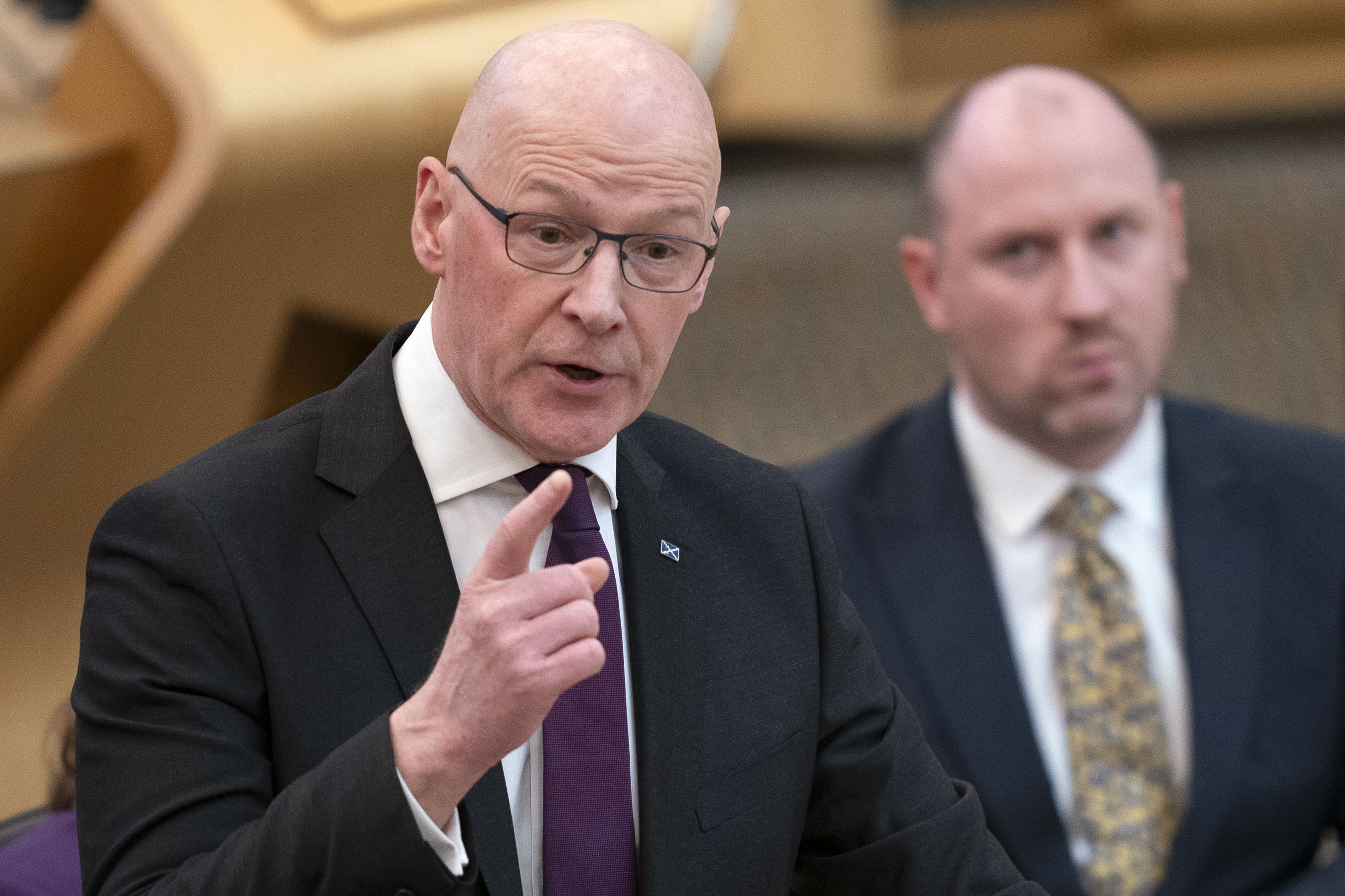 John Swinney defended Nicola Sturgeon’s record after she announced her intention to leave Holyrood (Jane Barlow/PA)