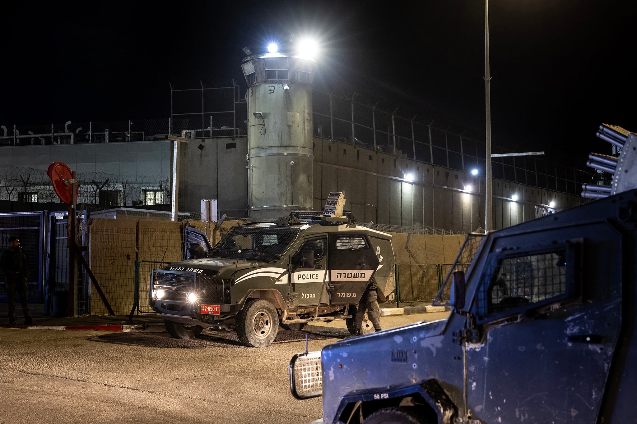 Israeli army vehicles are pictured outside the Ofer military prison located between Ramallah and Beitunia in the occupied West Bank on November 29, 2023