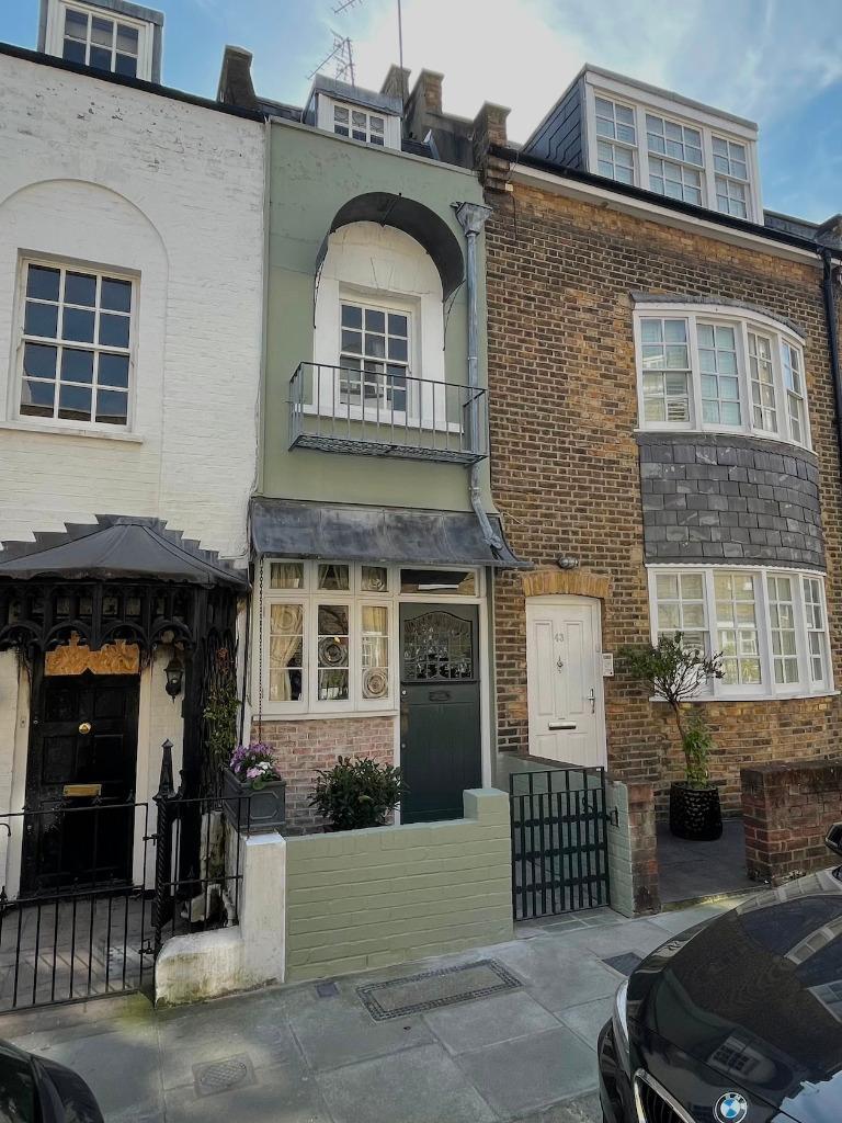 The three-storey property can be found squeezed between its neighbours on Peel Street, Notting Hill