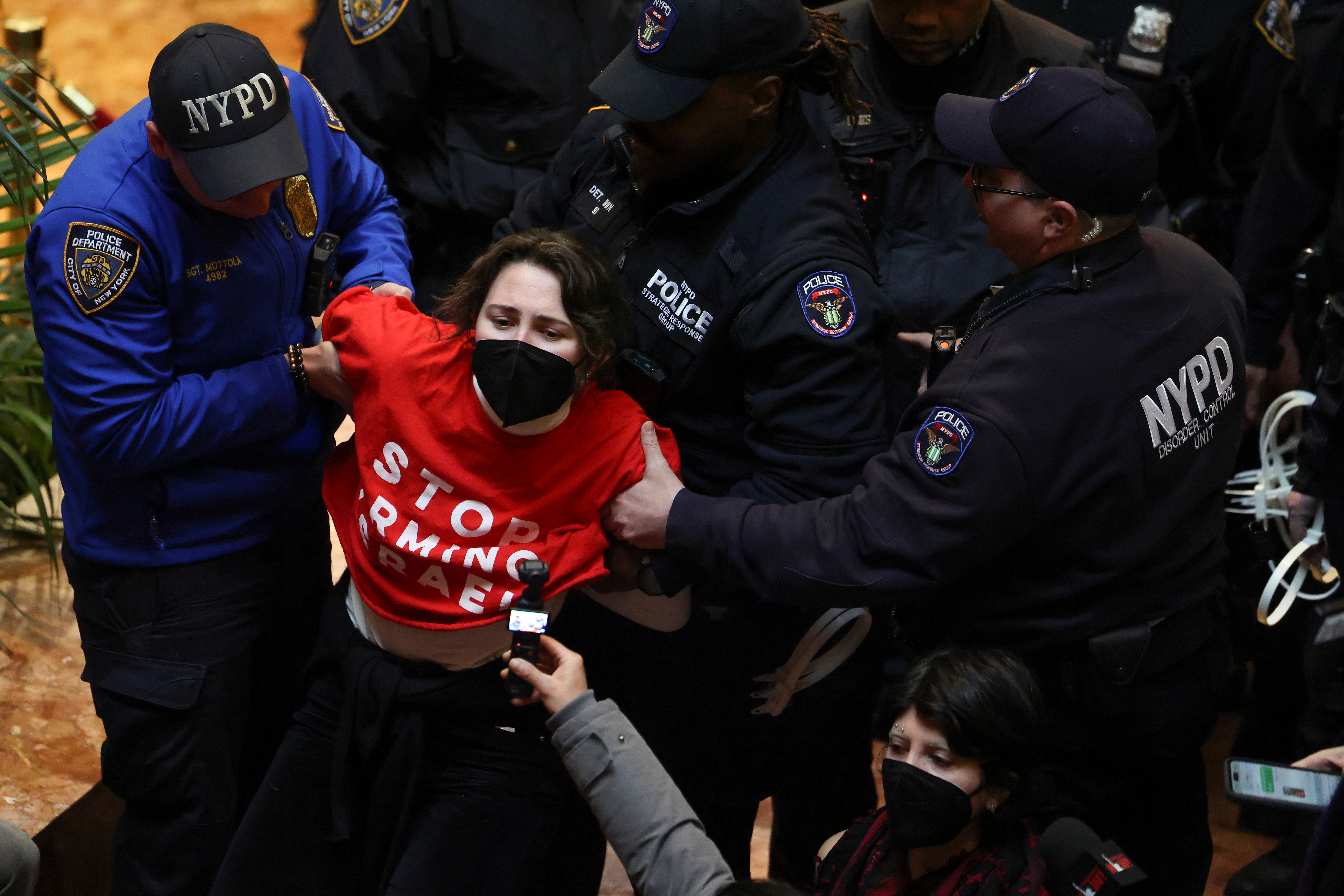 Chaotic scenes showed protesters, who were members of the group Jewish Voice For Peace, being dragged out of the building near to Central Park