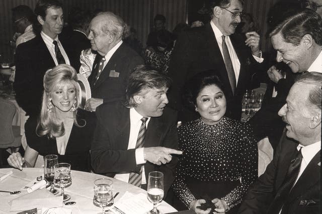 <p>Marla Maples, Donald Trump, Imelda Marcos and Joey Adams at a party in Helmsley Hotel, New York, in 1990</p>