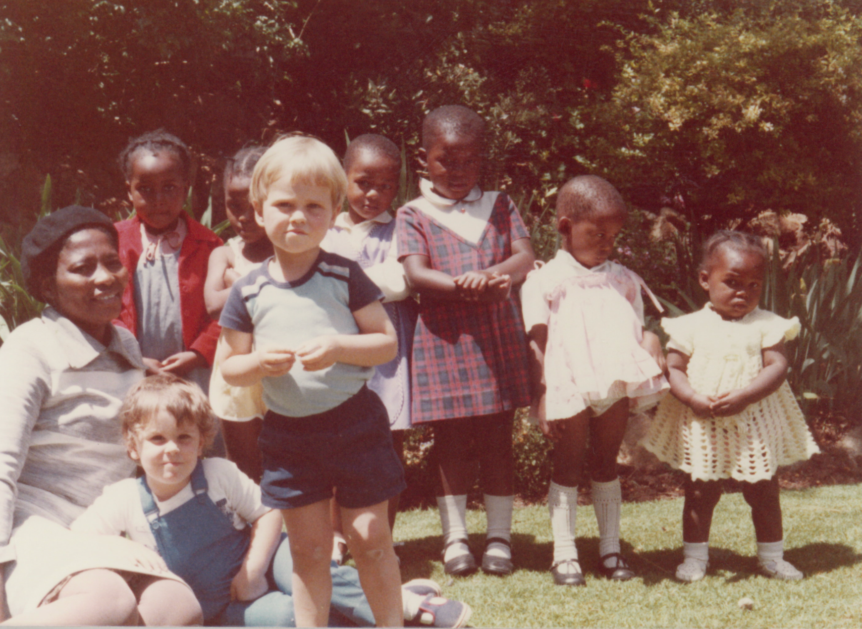 Mason (in dungarees) at the multi-racial nursery school his mum Kay set up in apartheid South Africa