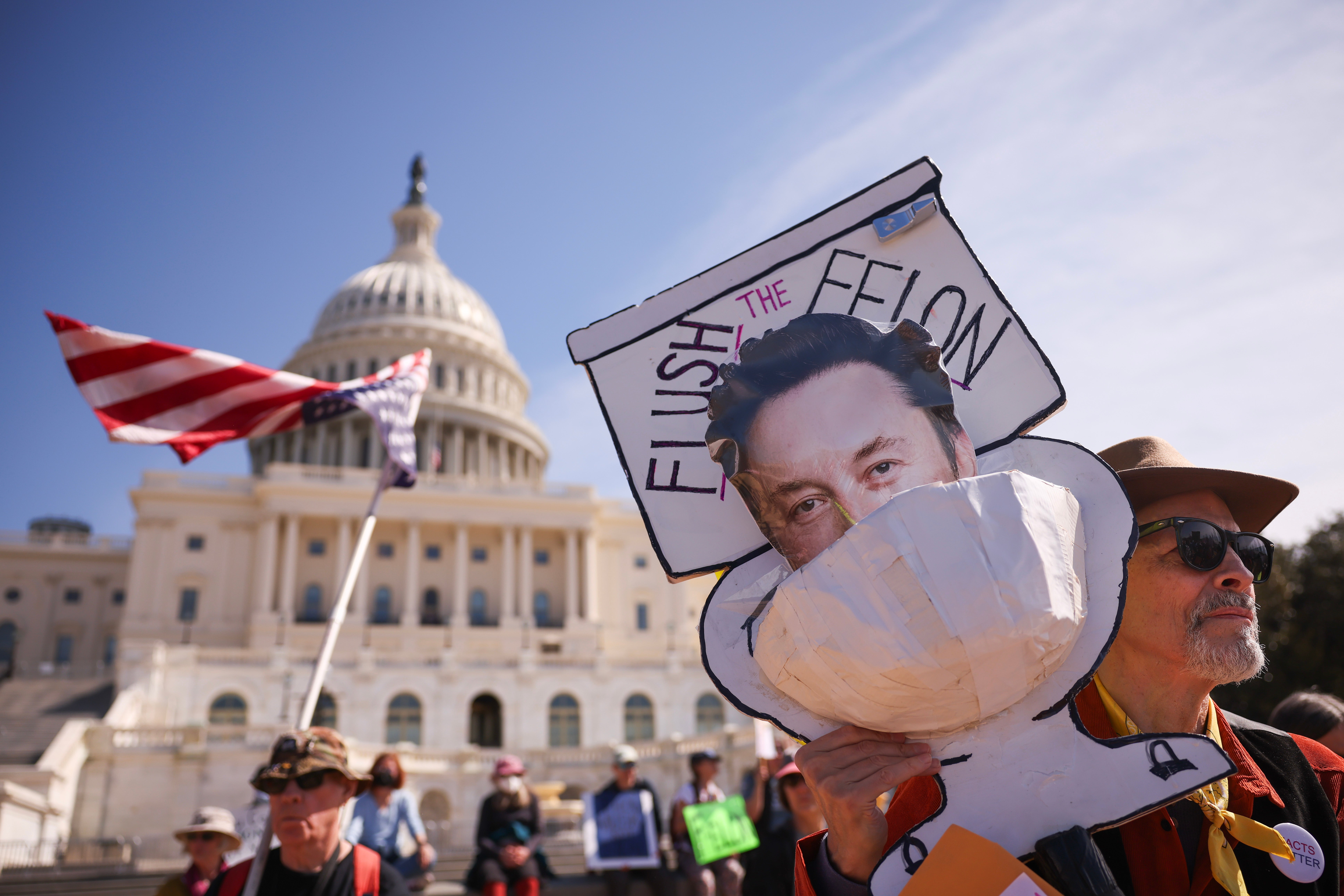Protesters outside the U.S. Capitol on March 10 called for bipartisan cooperation to prevent DOGE from seizing and dismantling federal agencies