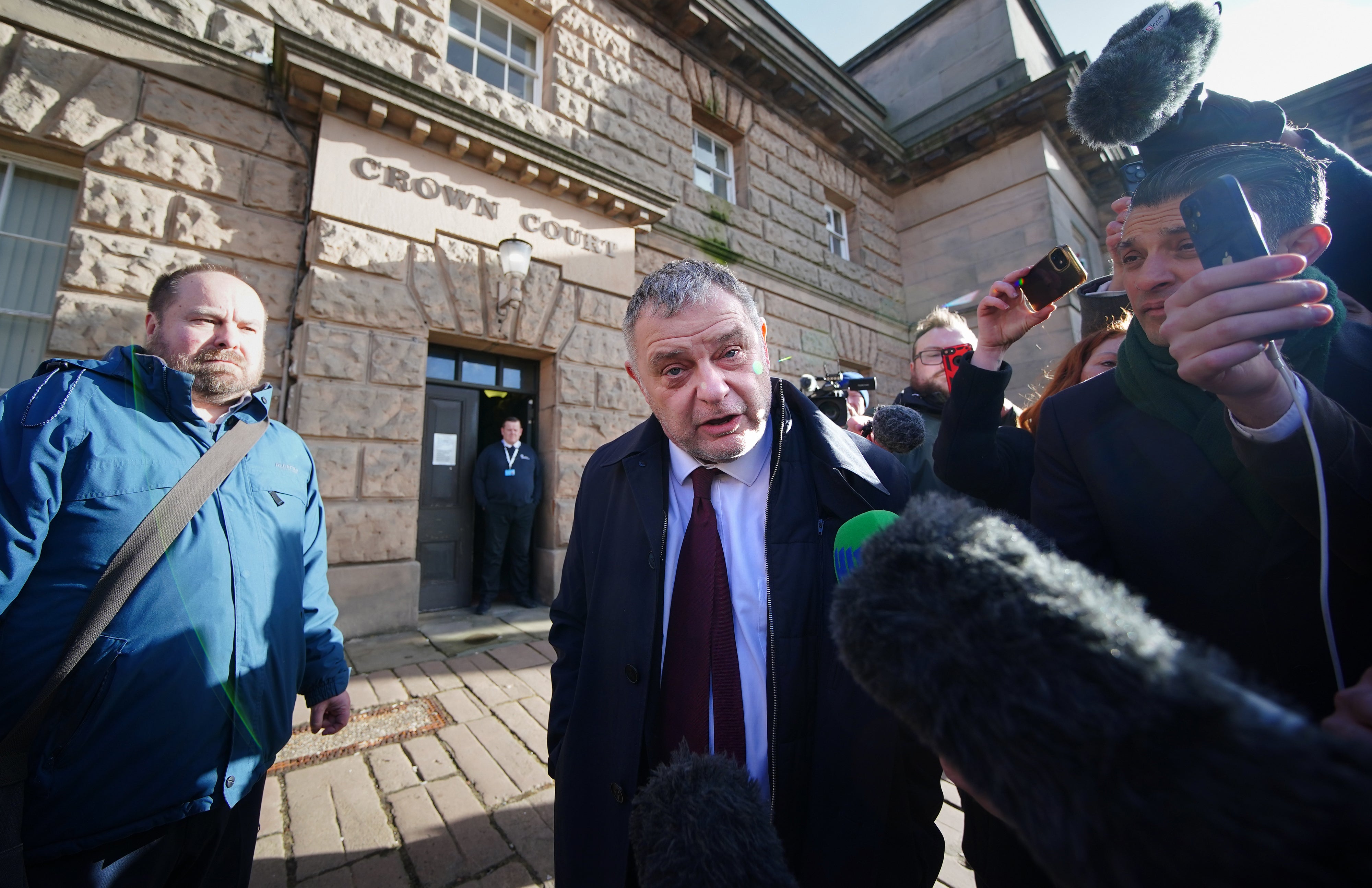 Runcorn and Helsby MP Mike Amesbury (centre) had his 10-week prison sentence for assault suspended for two years