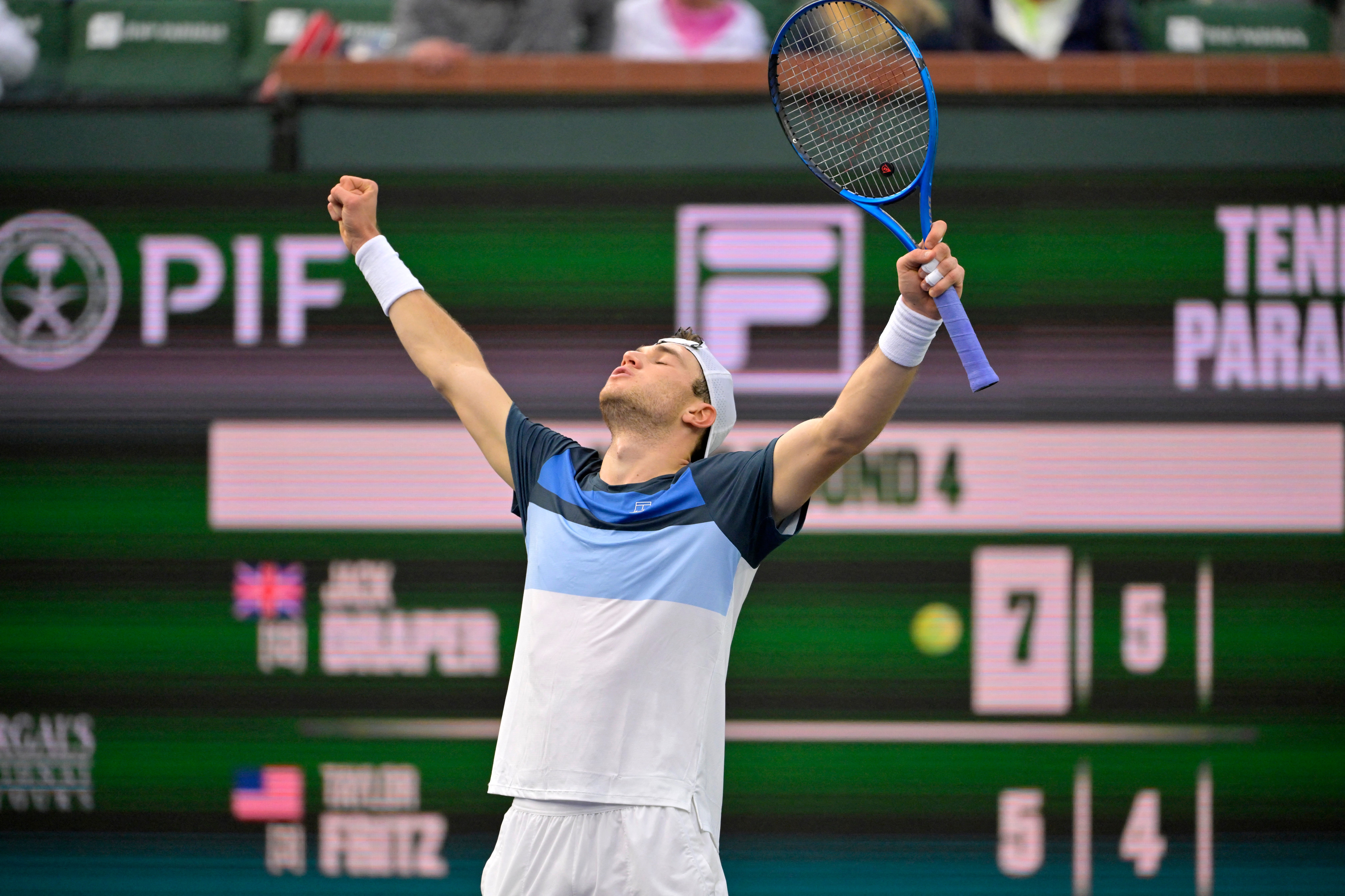 Jack Draper celebrates after beating Taylor Fritz