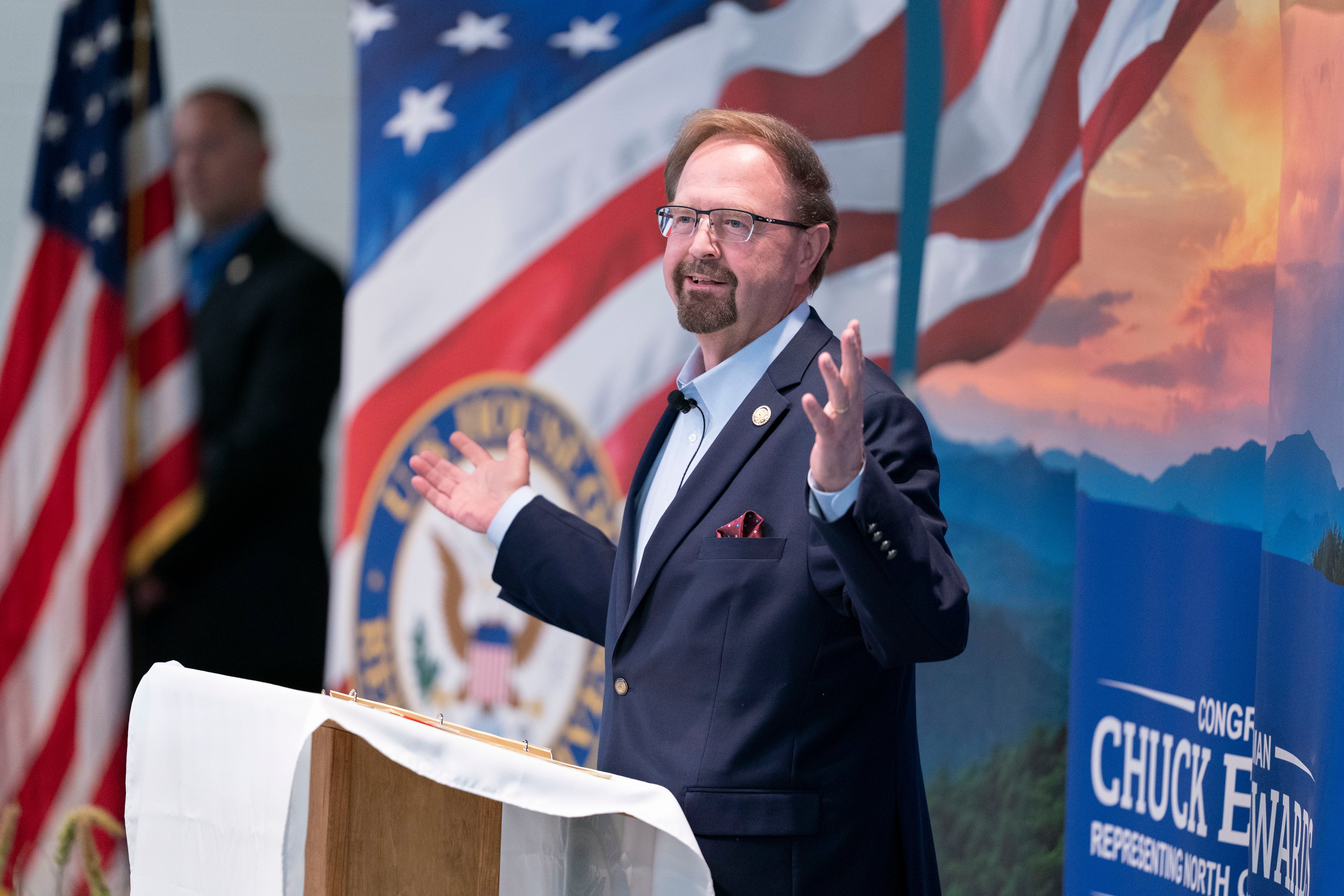 Rep. Chuck Edwards speaks to a crowd during a congressional town hall meeting on March 13, 2025 in Asheville, North Carolina, where he was heckled