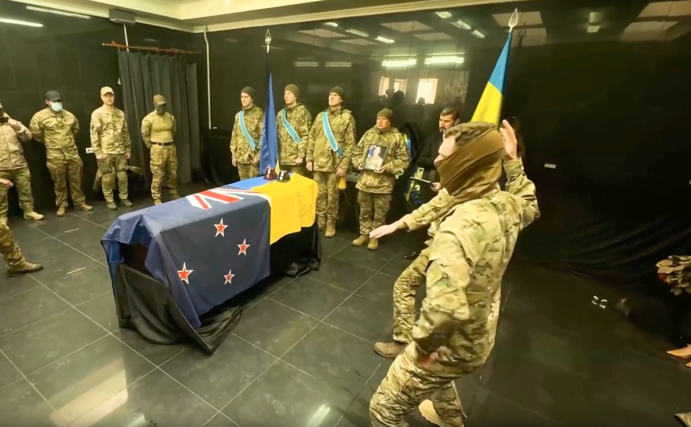 Ukrainian soldiers perform a haka to honour a fallen New Zealand soldier