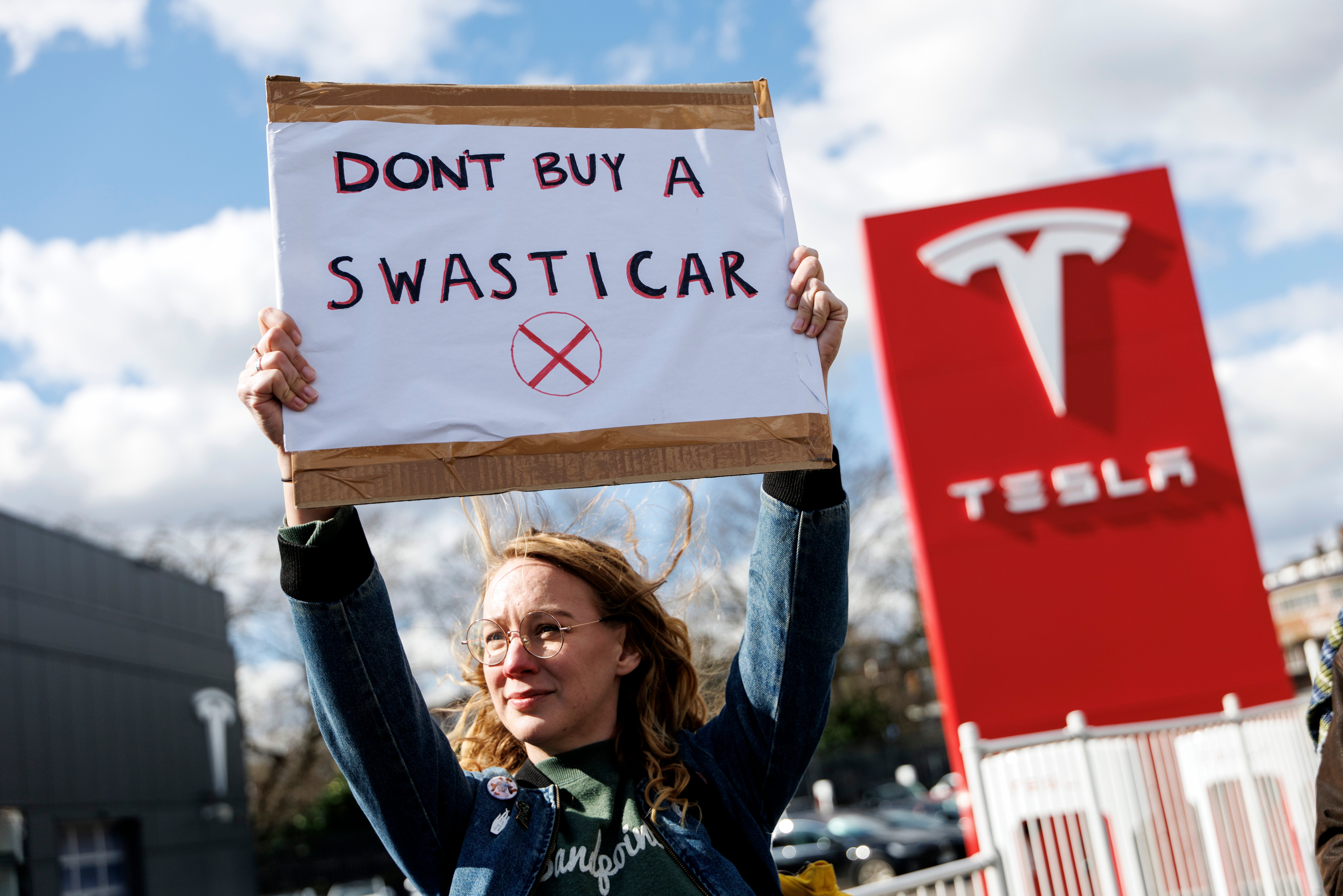 A protest outside a Tesla dealership in Park Royal in March