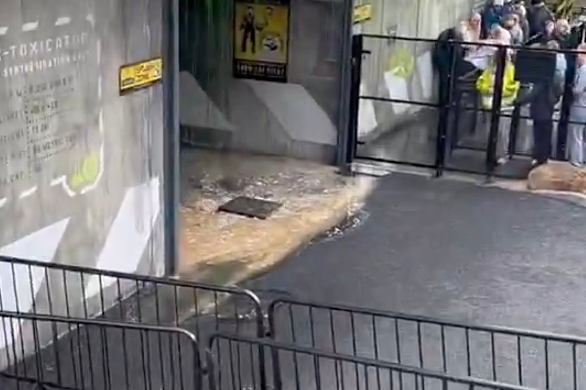 Video footage shows brown liquid flooding the ride’s entrance from an overflowing drain