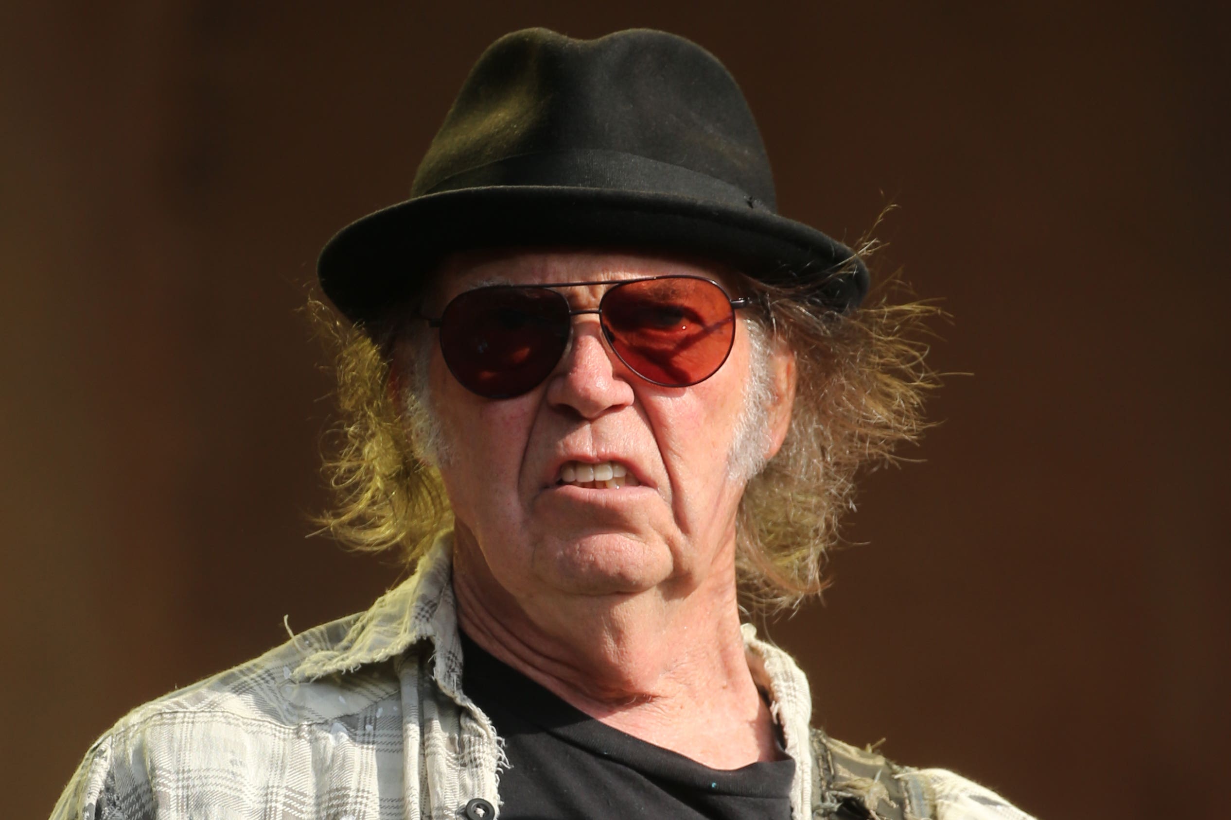 In a post on his website, the Heart of Gold singer said he and others in the industry were ‘not scared’ of the president and expressed his support for fellow musician Bruce Springsteen