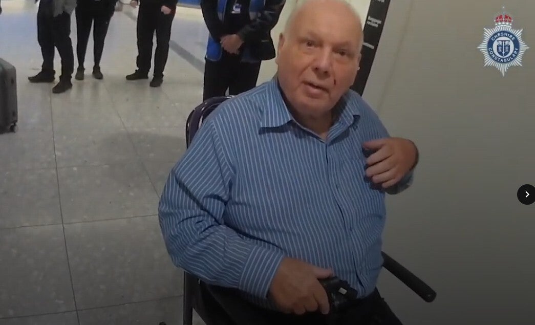 A screengrab taken from body worn video of the arrest of Richard Burrows at Heathrow Airport