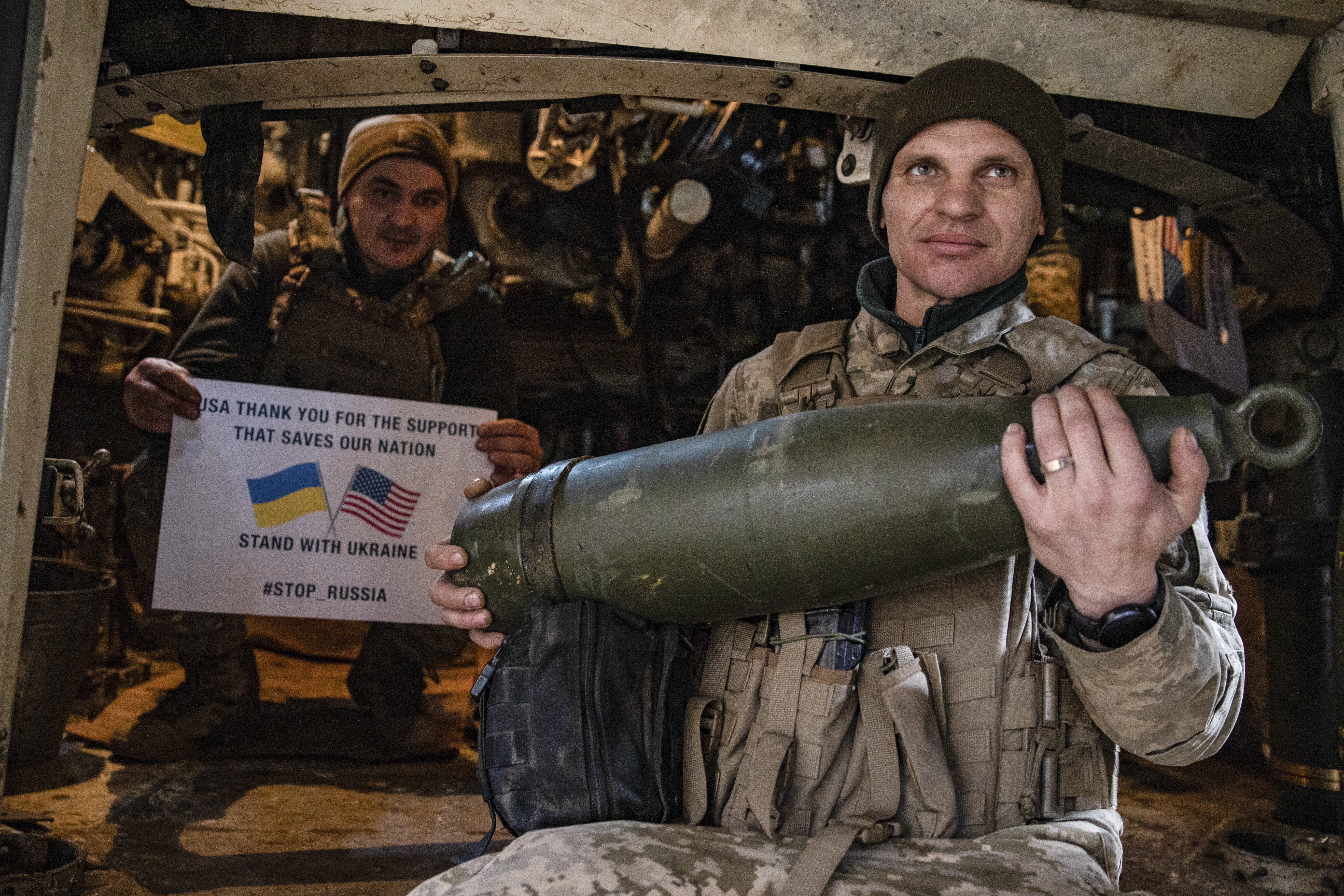 Soldiers of Ukraine's 5th brigade hold a poster thanking the U.S. for support at the front line near Toretsk, Donetsk region, Ukraine, Tuesday, March 11, 2025