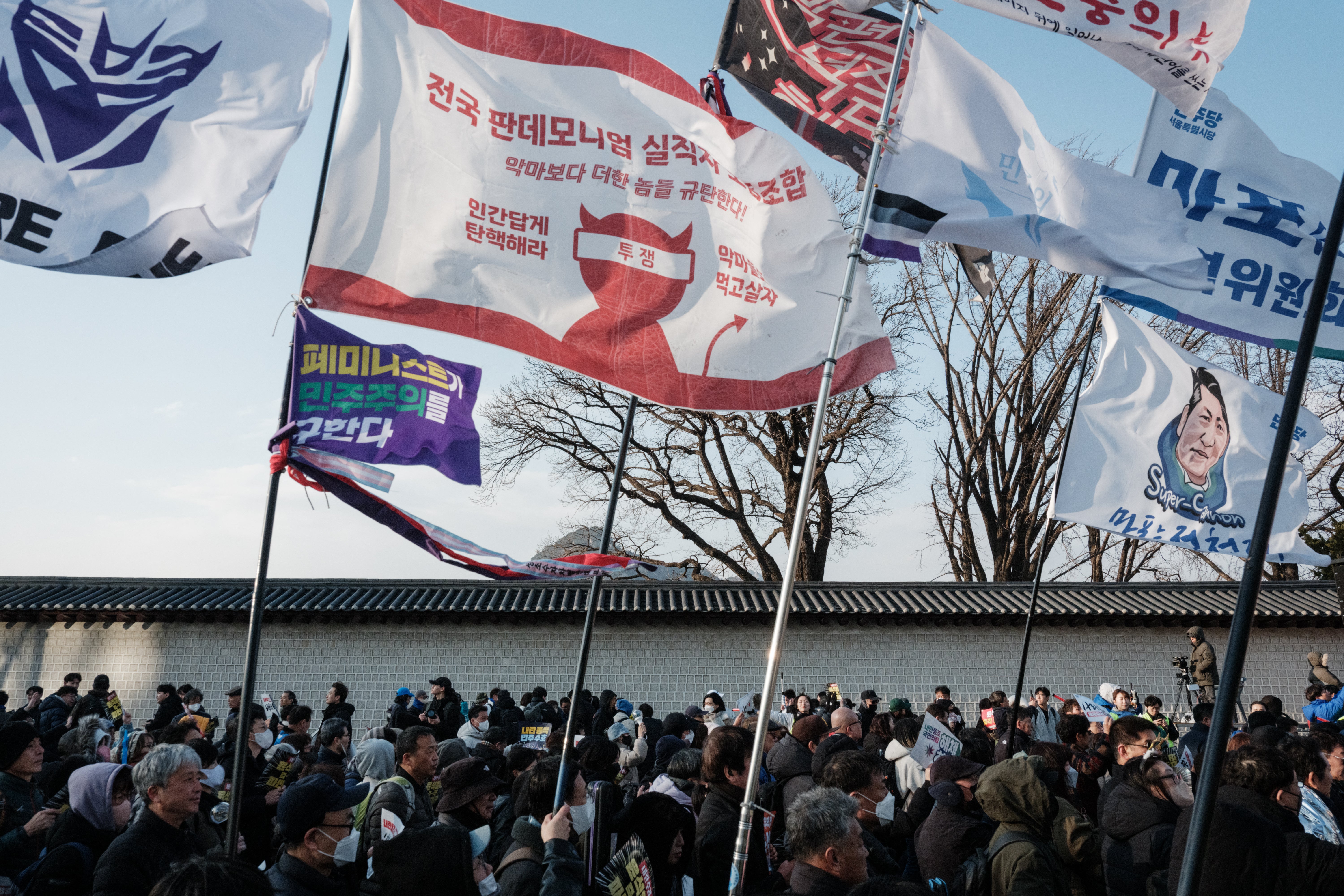 Protesters march during a demonstration against impeached South Korean president Yoon Suk Yeol in Seoul on 16 March 2025