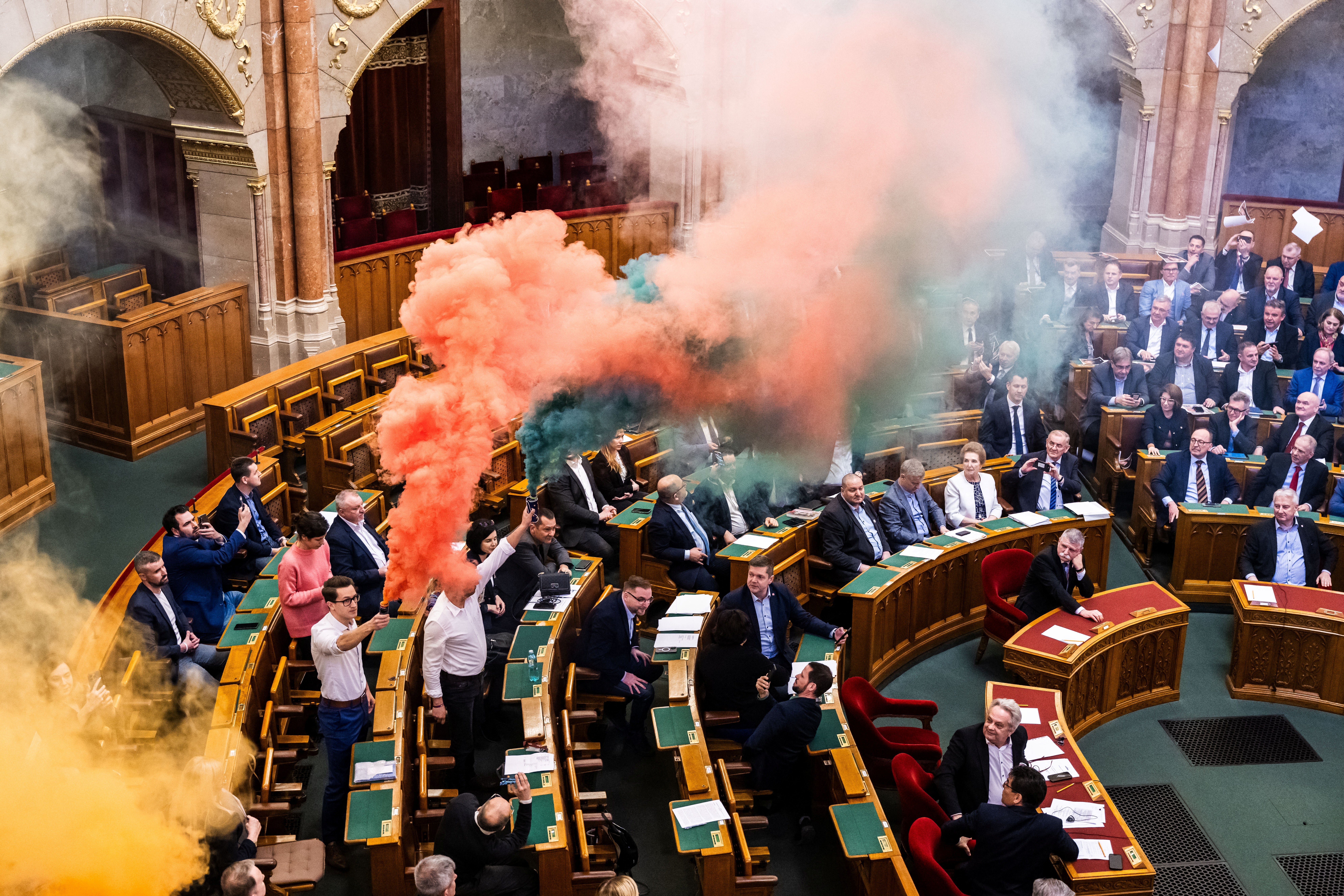 Smoke flares were set off inside Hungary’s parliament during the vote