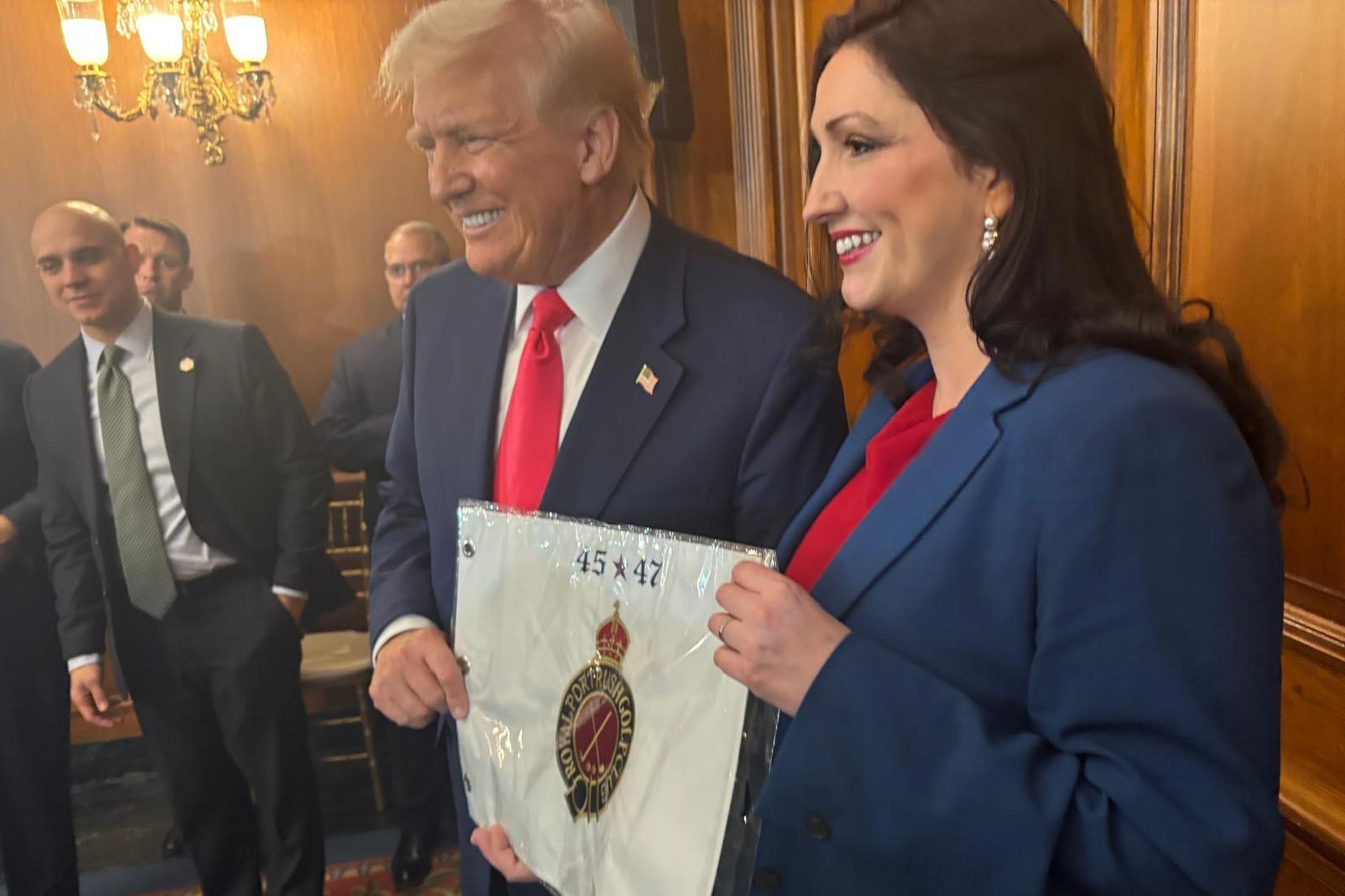Deputy First Minister Emma Little-Pengelly presenting US President Donald Trump with a personalised flag from Royal Portrush Golf Club, at the US Capitol in Washington, DC (DUP/PA)
