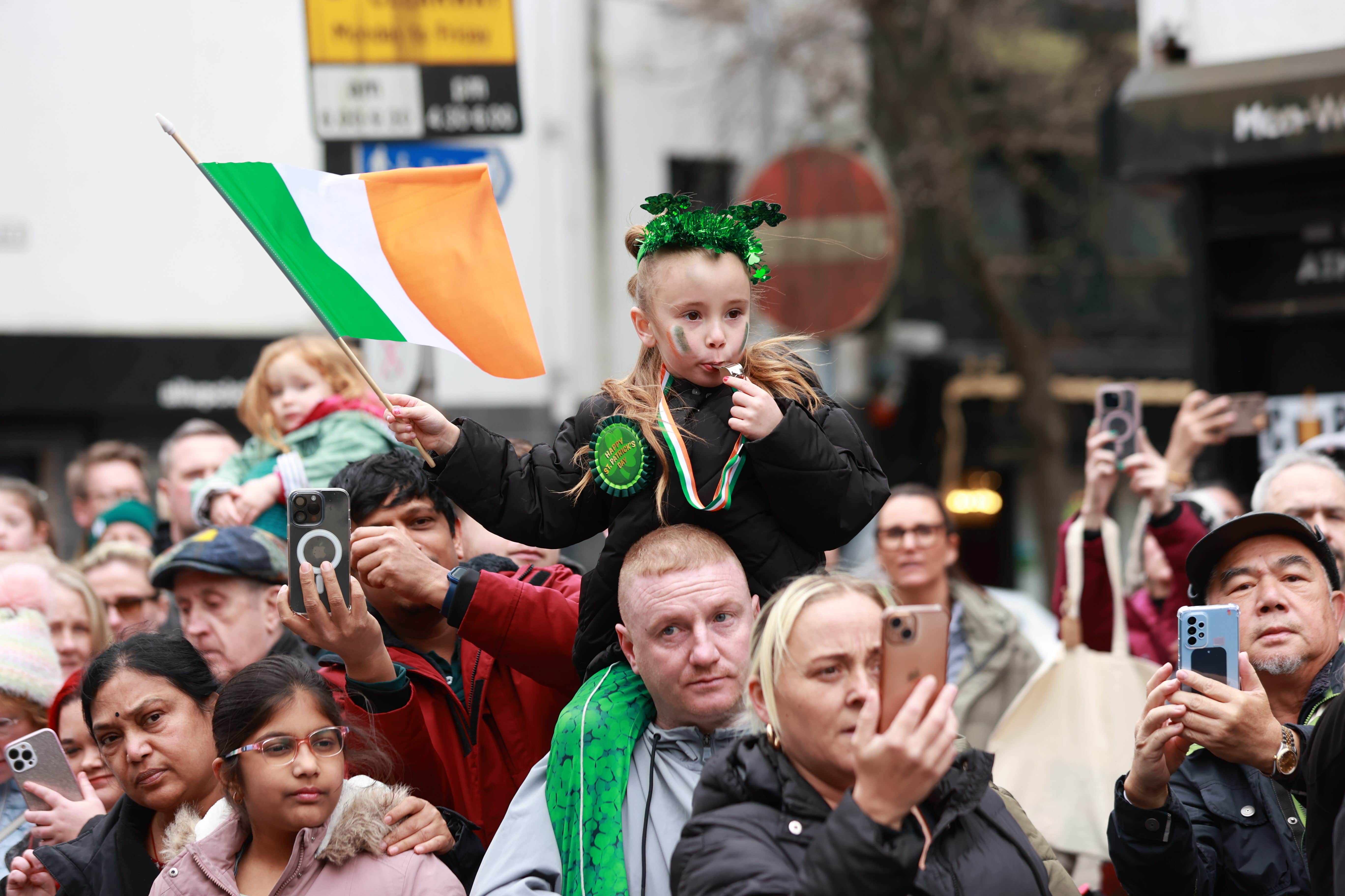 People attending the St Patrick’s Day Parade in Belfast (Liam McBurney/PA)