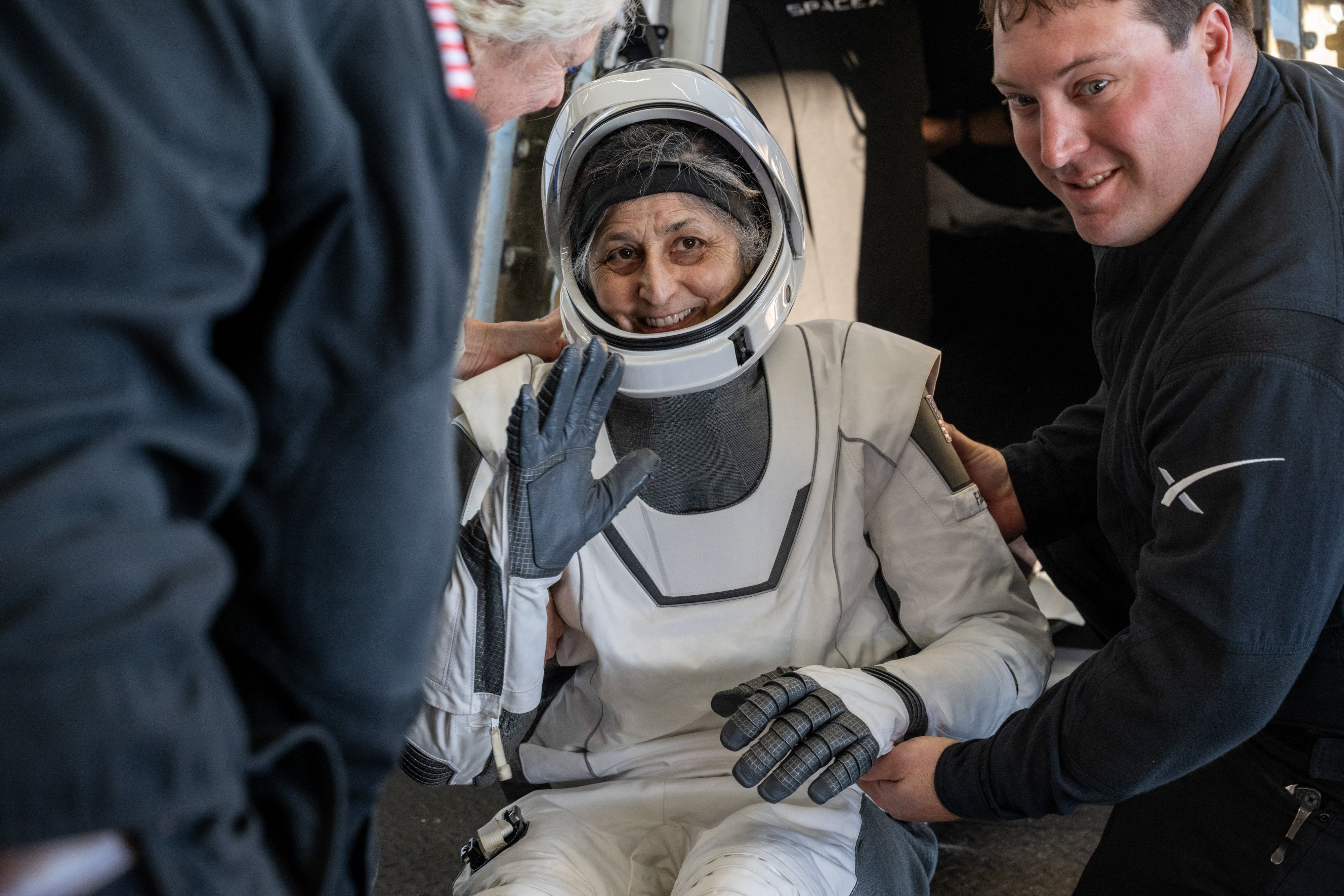 Nasa astronaut Suni Williams is helped out of a SpaceX Dragon spacecraft after landing in the water off Florida